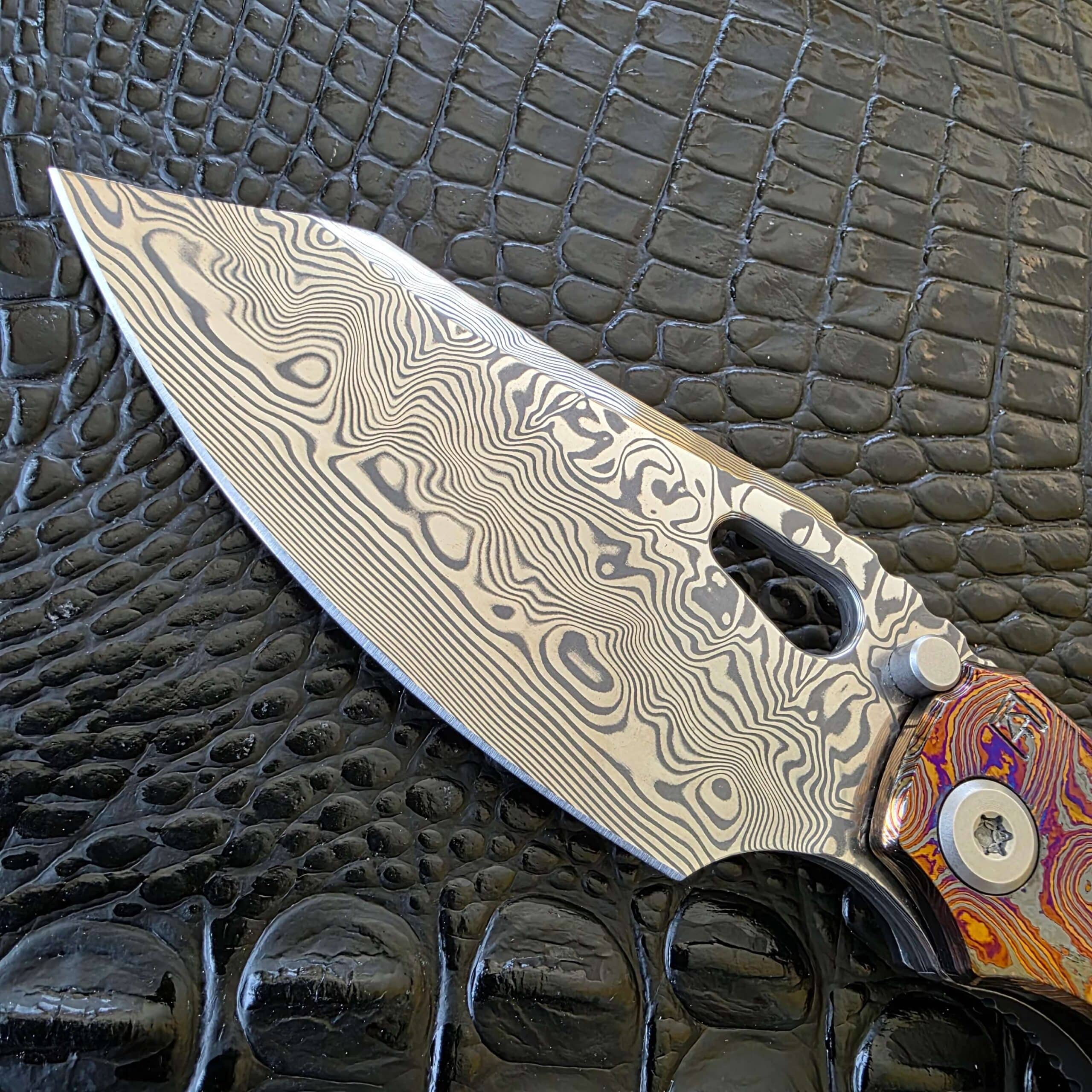 Damasteel blade pattern on Custom Knife Factory Evo 3.0E