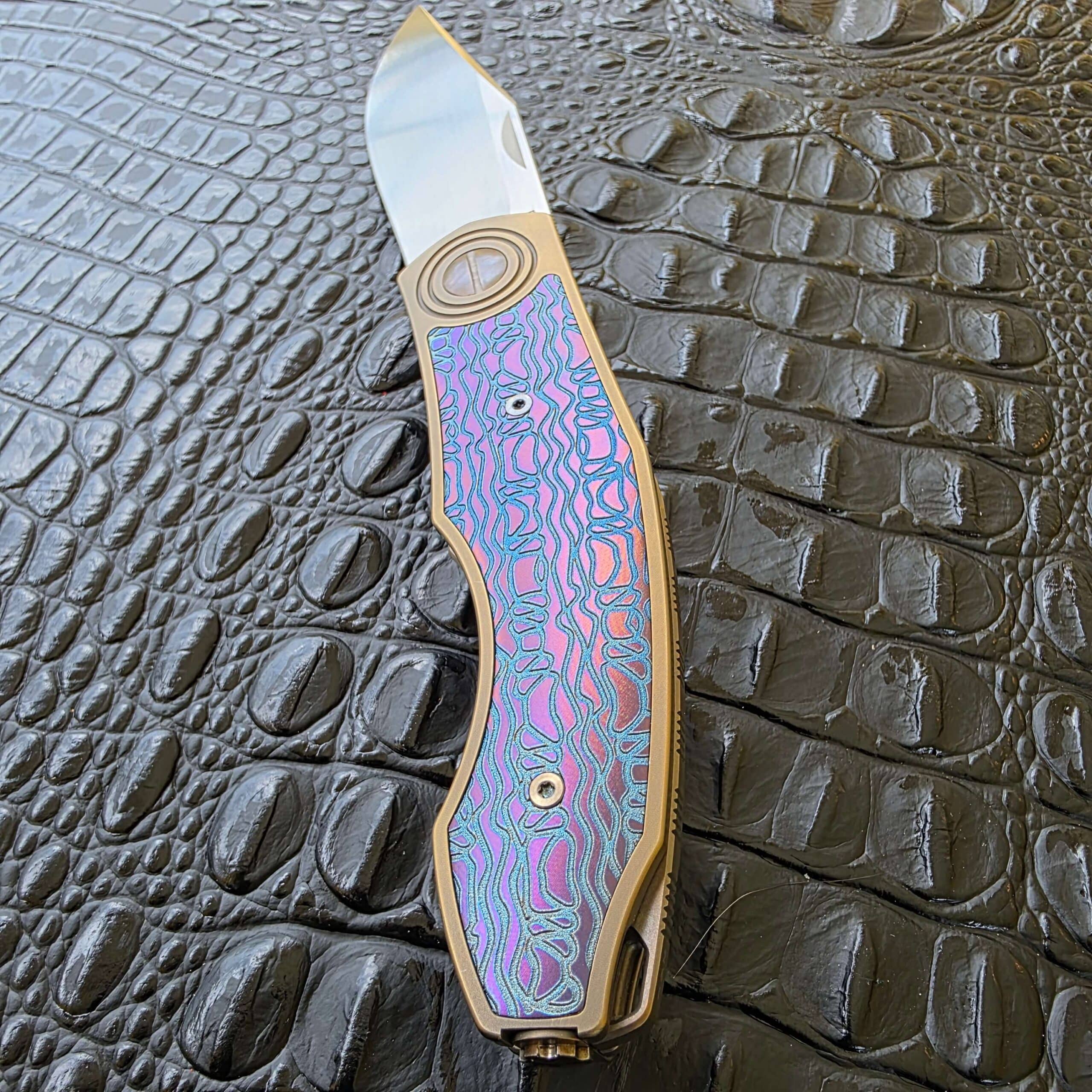 Upper section of CKF Veksha custom anodized inlay