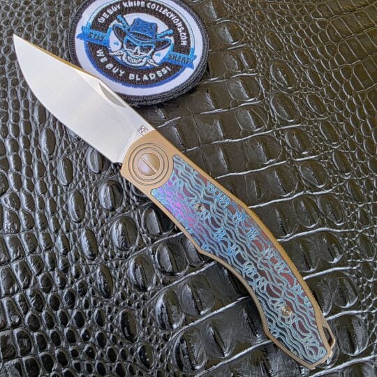 CKF Veksha One-Off open with M390 blade and anodized inlays