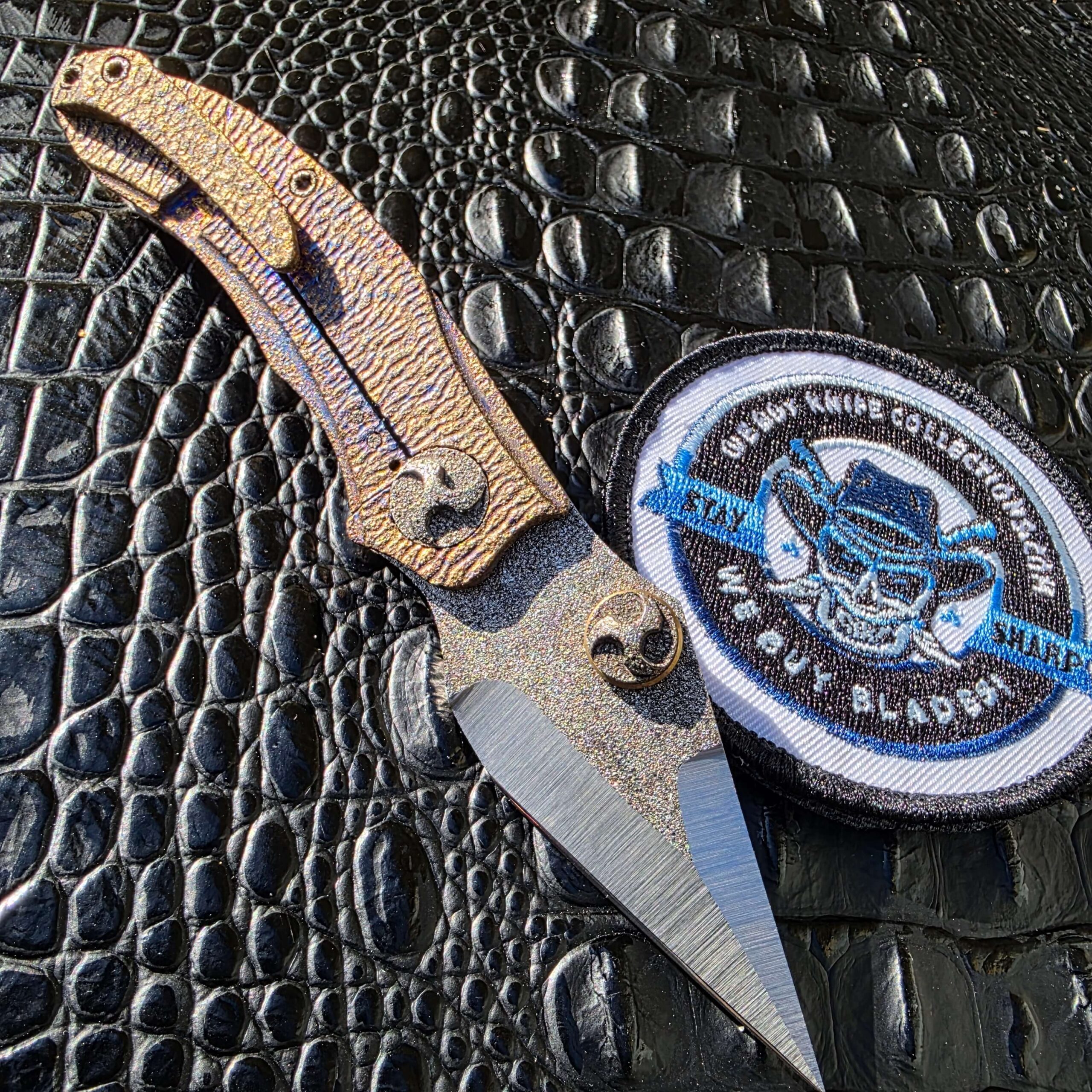 Glenn Waters Viper 2 open clip side with textured titanium frame
