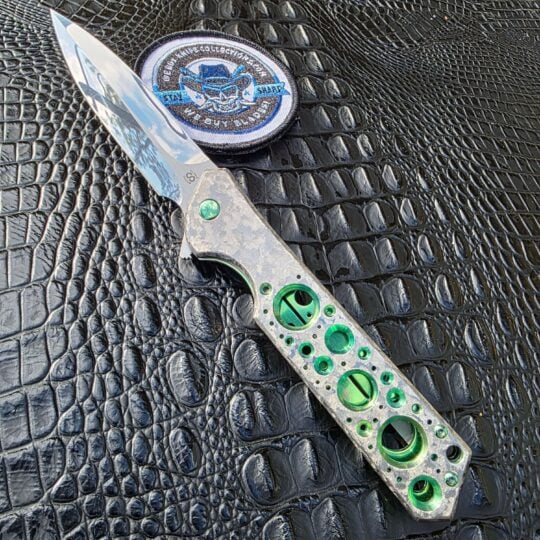 Olamic Cutlery Rainmaker with M390 blade and green accented titanium handle