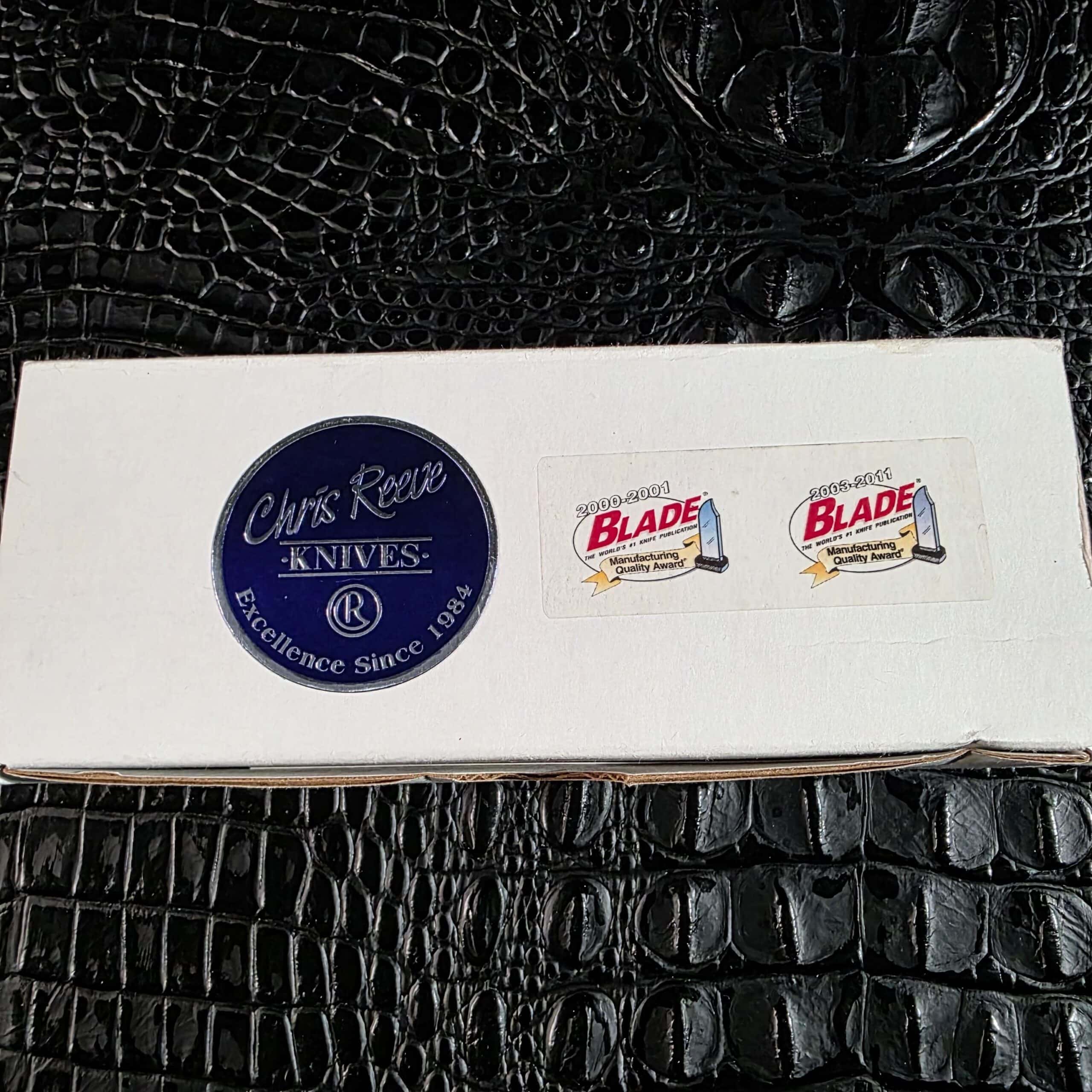 Original white Chris Reeve Knives box with BLADE Manufacturing Quality Award stickers