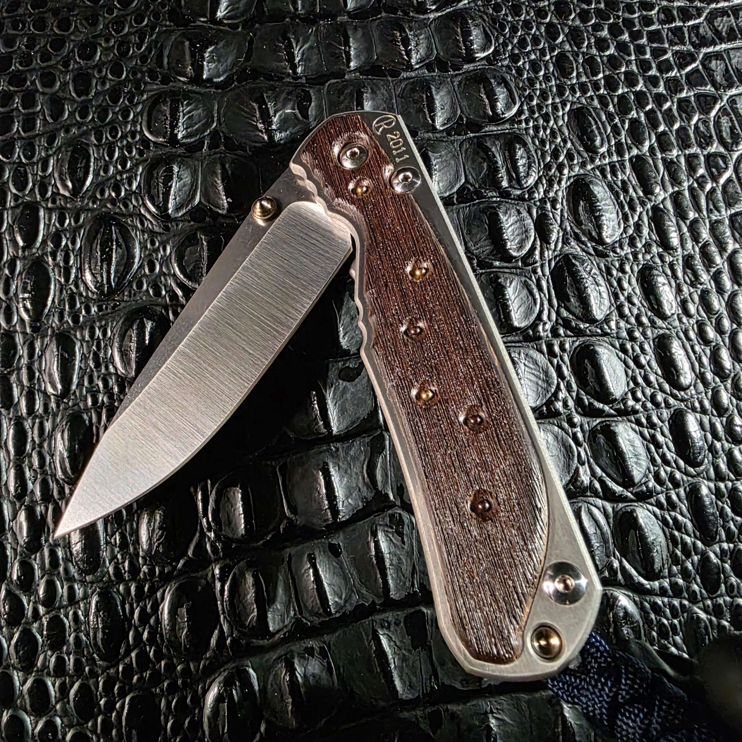 Chris Reeve Large Sebenza 2011 Edition partially open showing the pivot and lock face