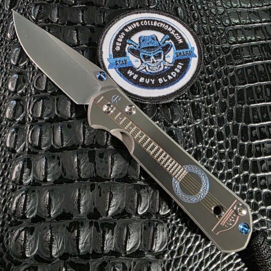 Chris Reeve Large Sebenza 21 CGG Acoustic open with milled guitar graphic and S35VN blade
