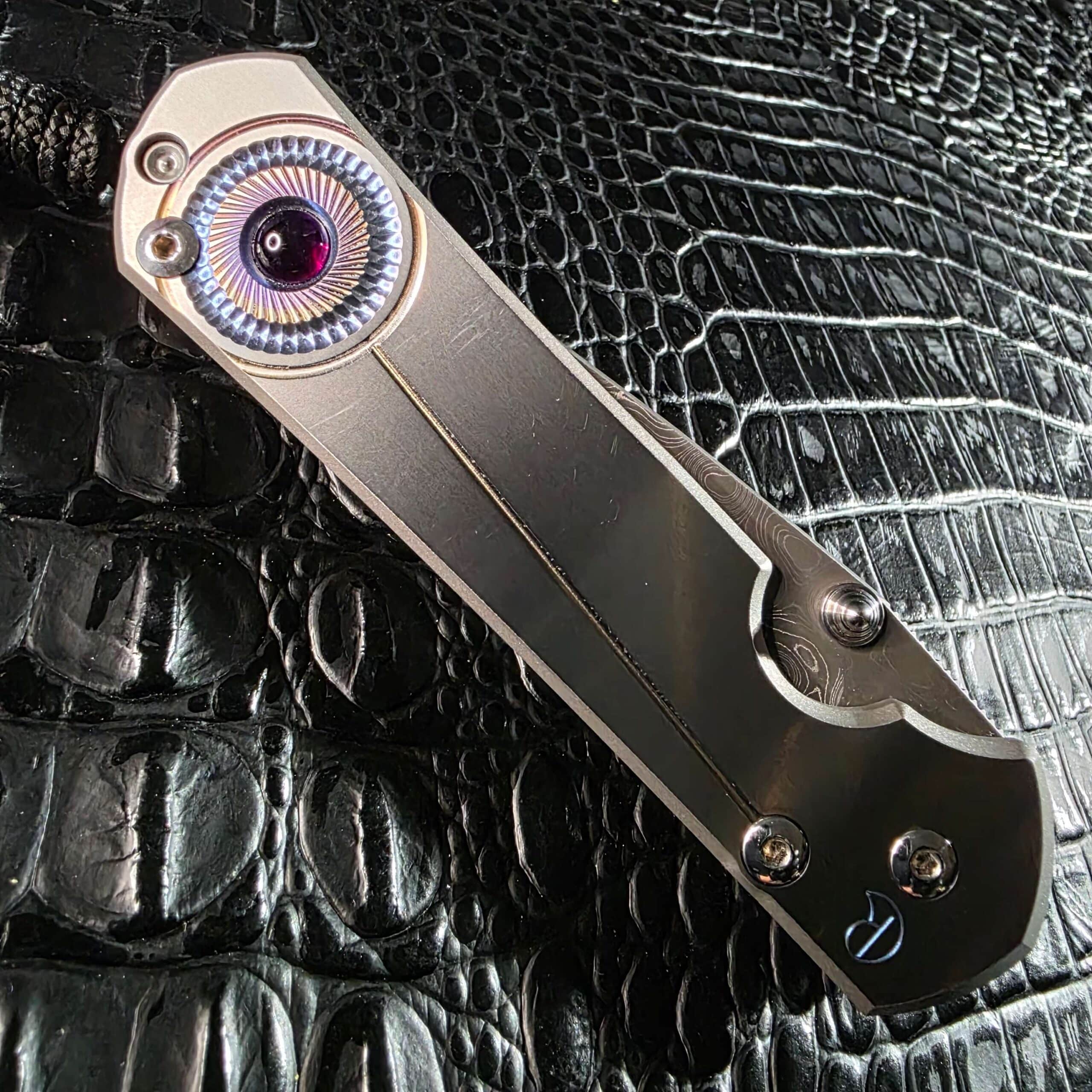 Closed Chris Reeve Sebenza 21 Unique Graphic titanium handle with amethyst inlay