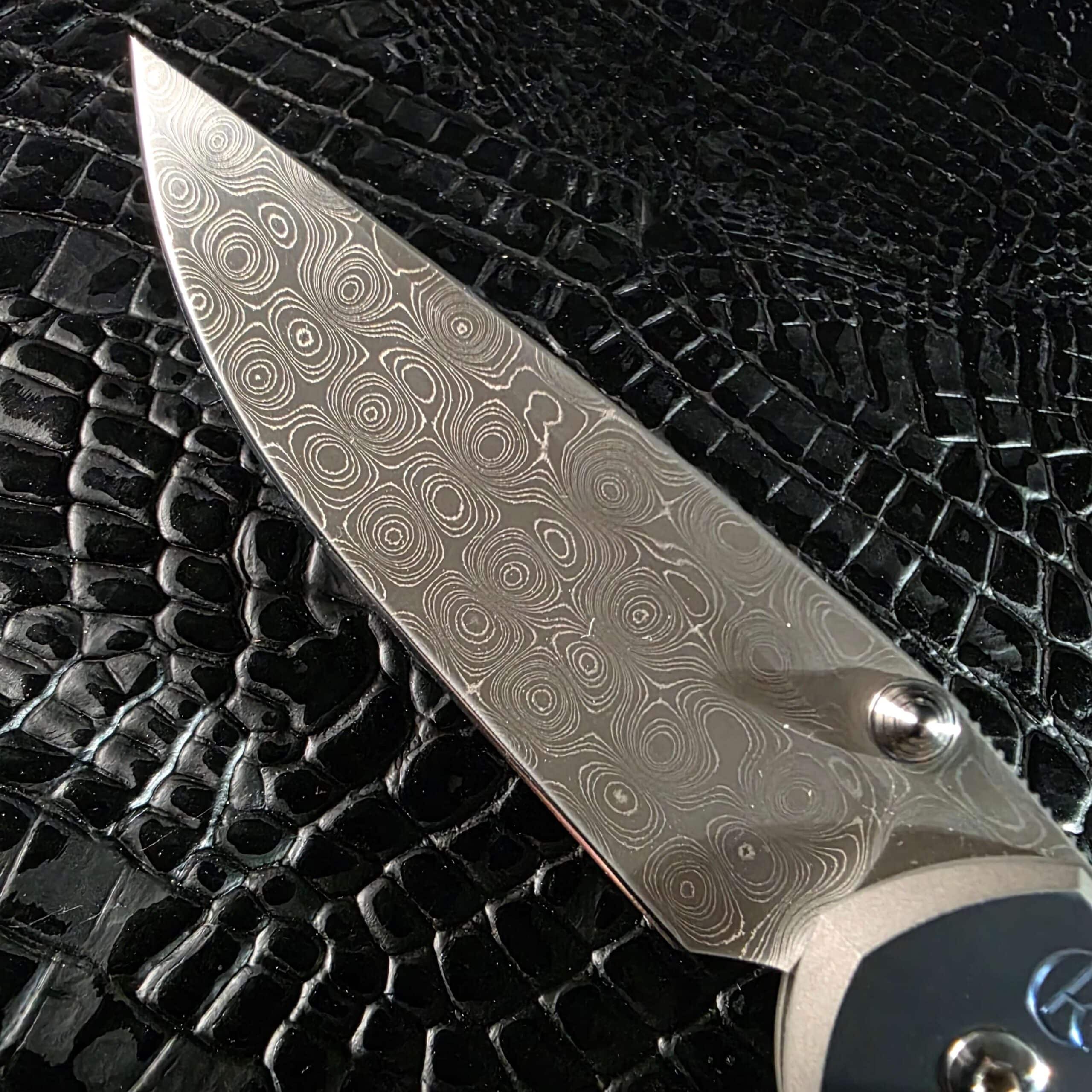 Devin Thomas Raindrop Damascus pattern on Chris Reeve Sebenza 21 blade