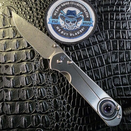 Chris Reeve Large Sebenza 21 Unique Graphic open with Devin Thomas Raindrop Damascus blade and amethyst cabochon