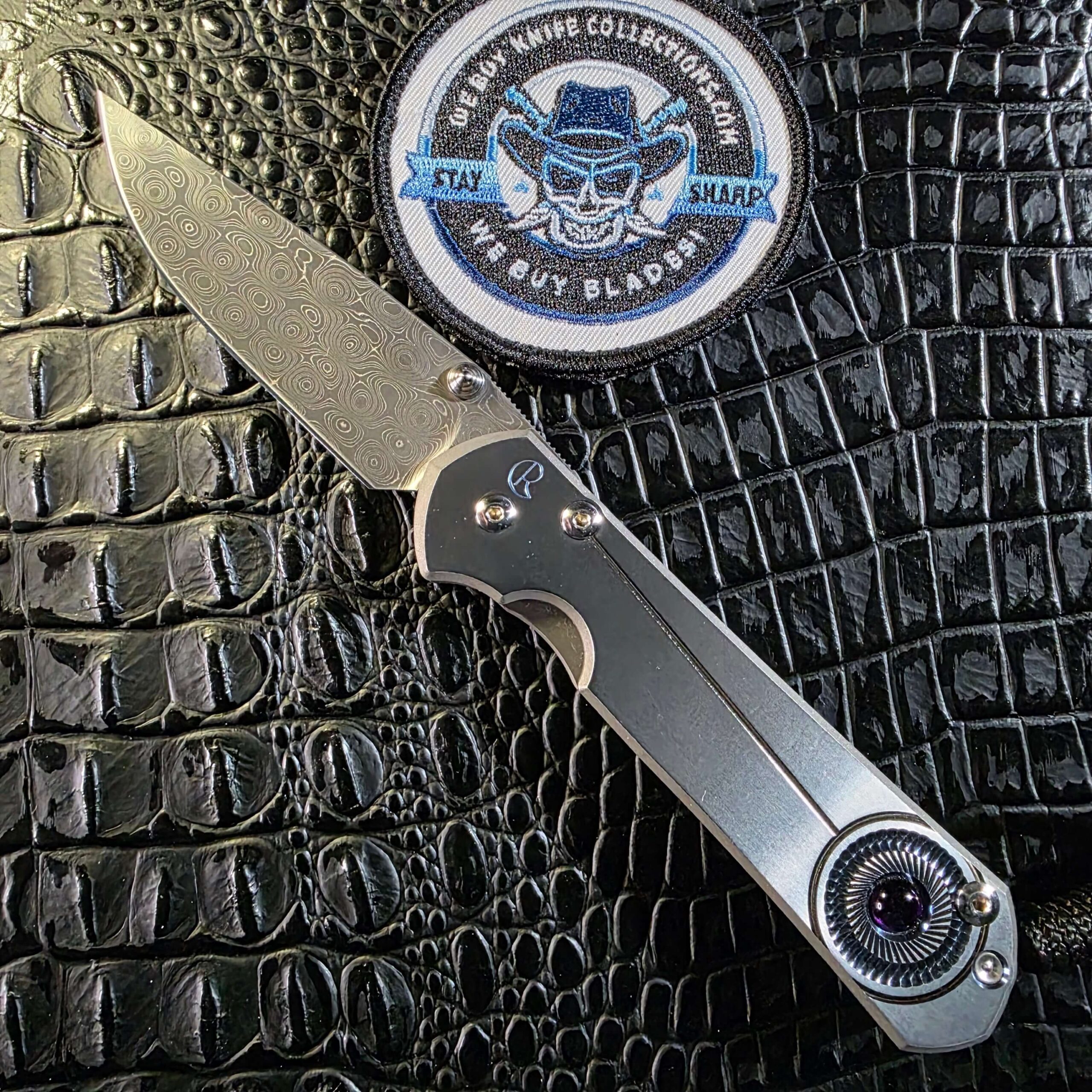 Chris Reeve Large Sebenza 21 Unique Graphic open with Devin Thomas Raindrop Damascus blade and amethyst cabochon