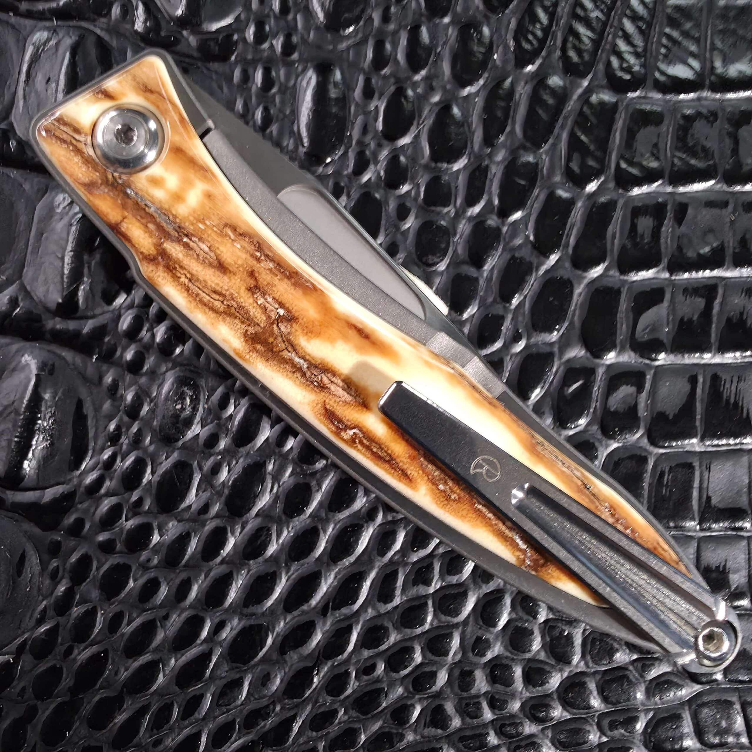 Angled closed view of the Chris Reeve Mnandi with pocket clip and pivot
