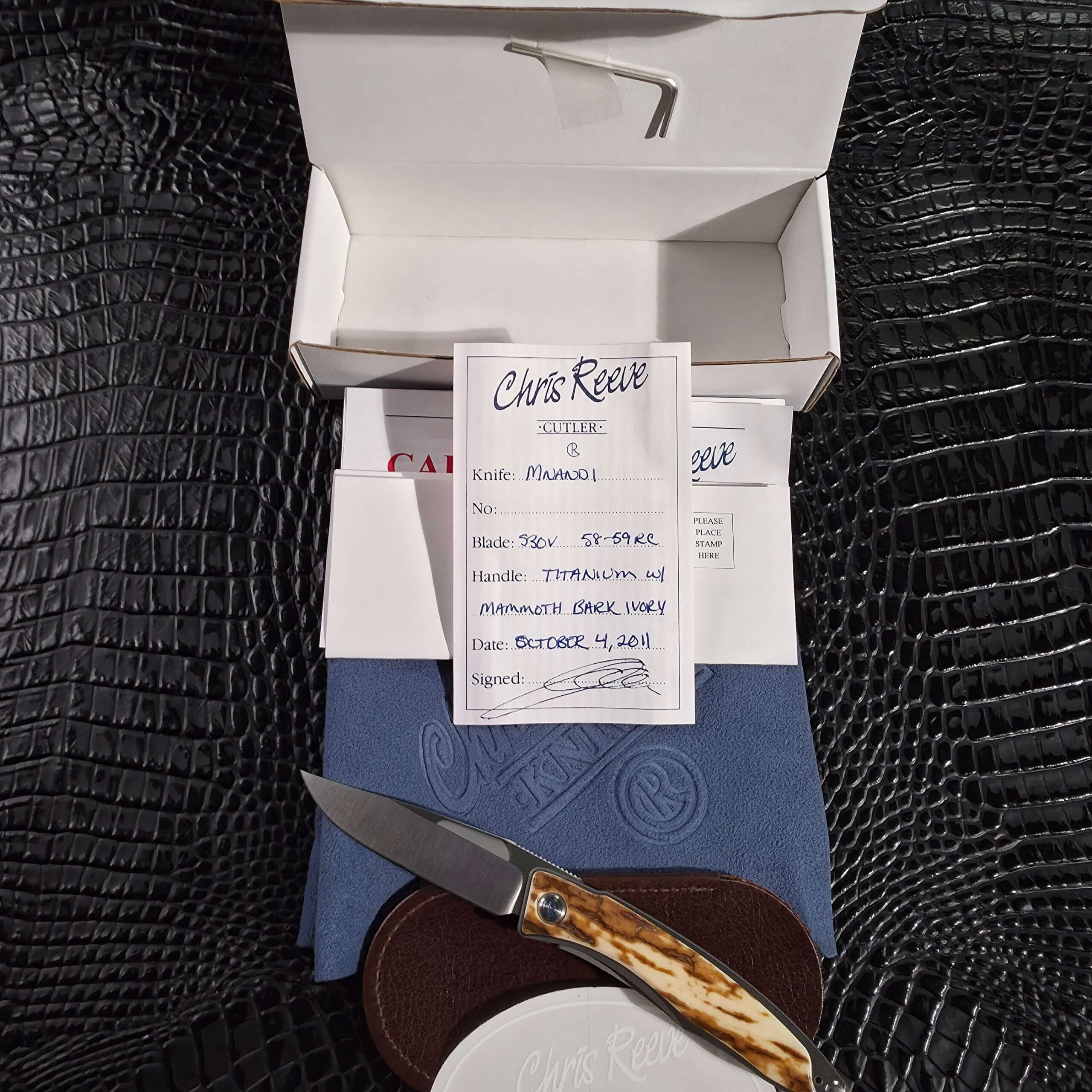 Chris Reeve Mnandi with original box, birth card, leather slip, hex tool, and cloth