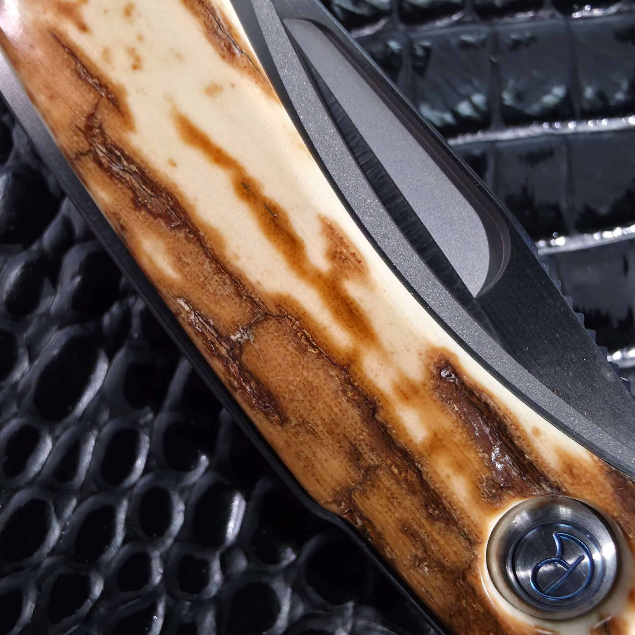Hand-satin S30V blade with flat hollow grind on the Chris Reeve Mnandi