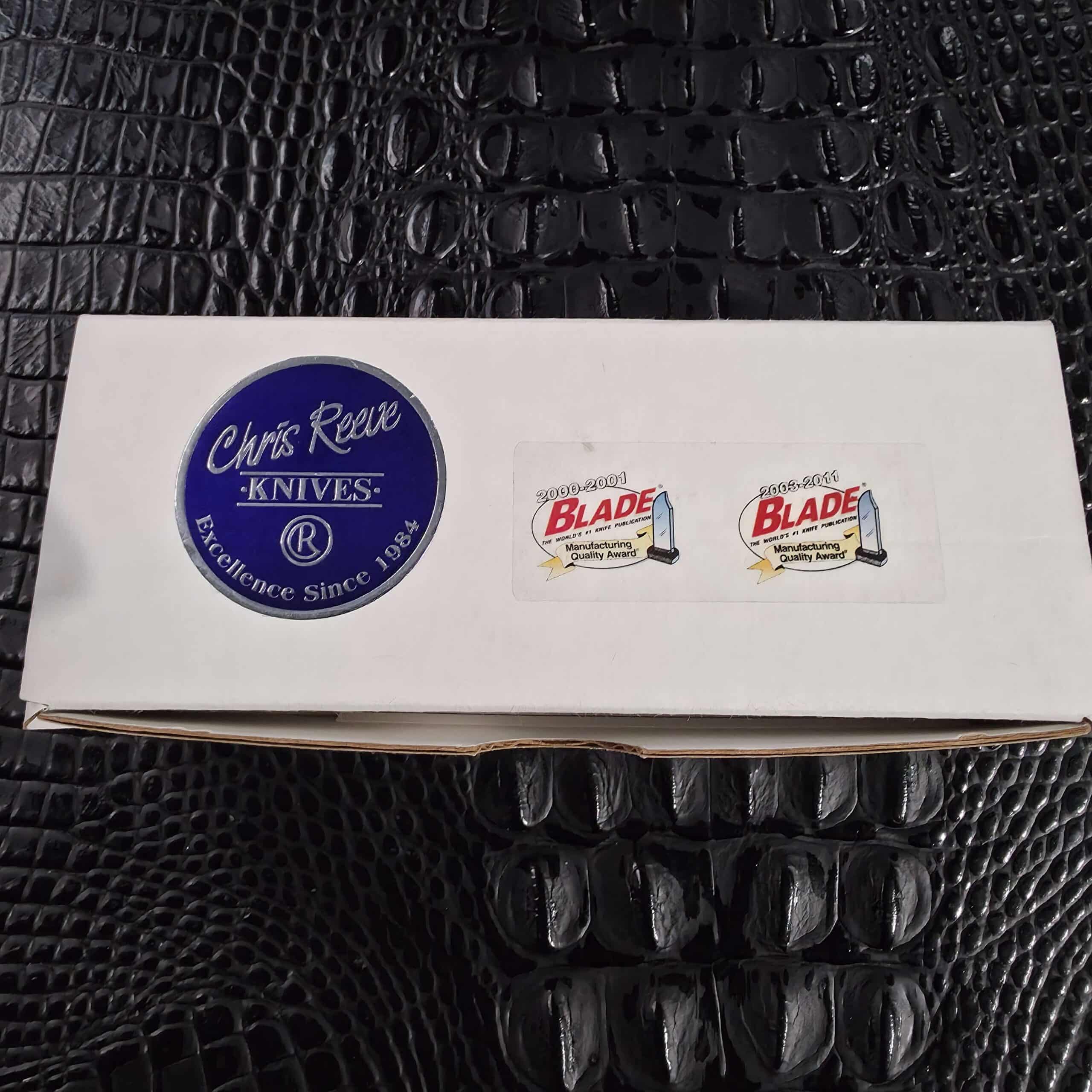Original white Chris Reeve Knives box with BLADE Manufacturing Quality Award stickers