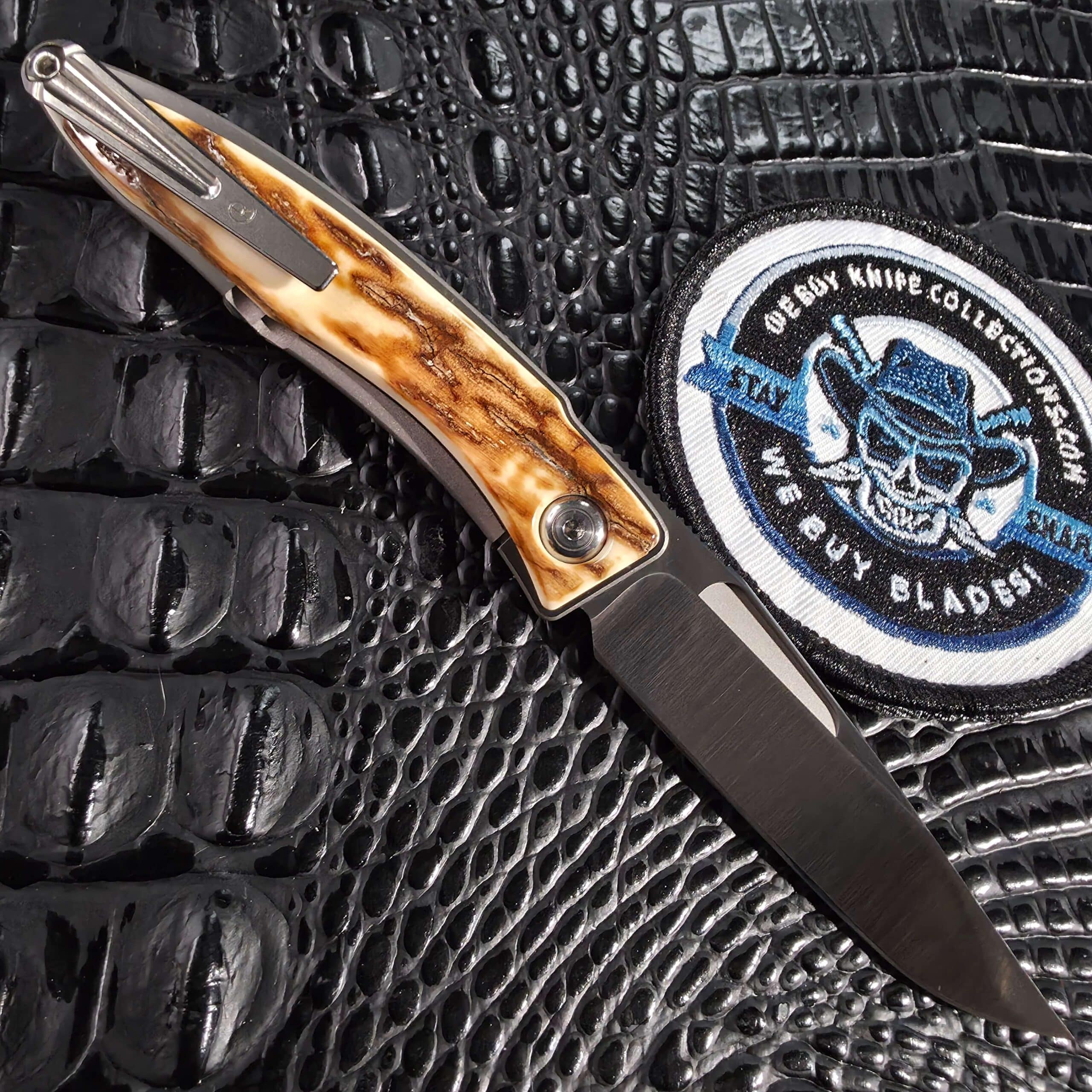 Chris Reeve Mnandi 2011 clip side open showing titanium pocket clip and mammoth bark ivory