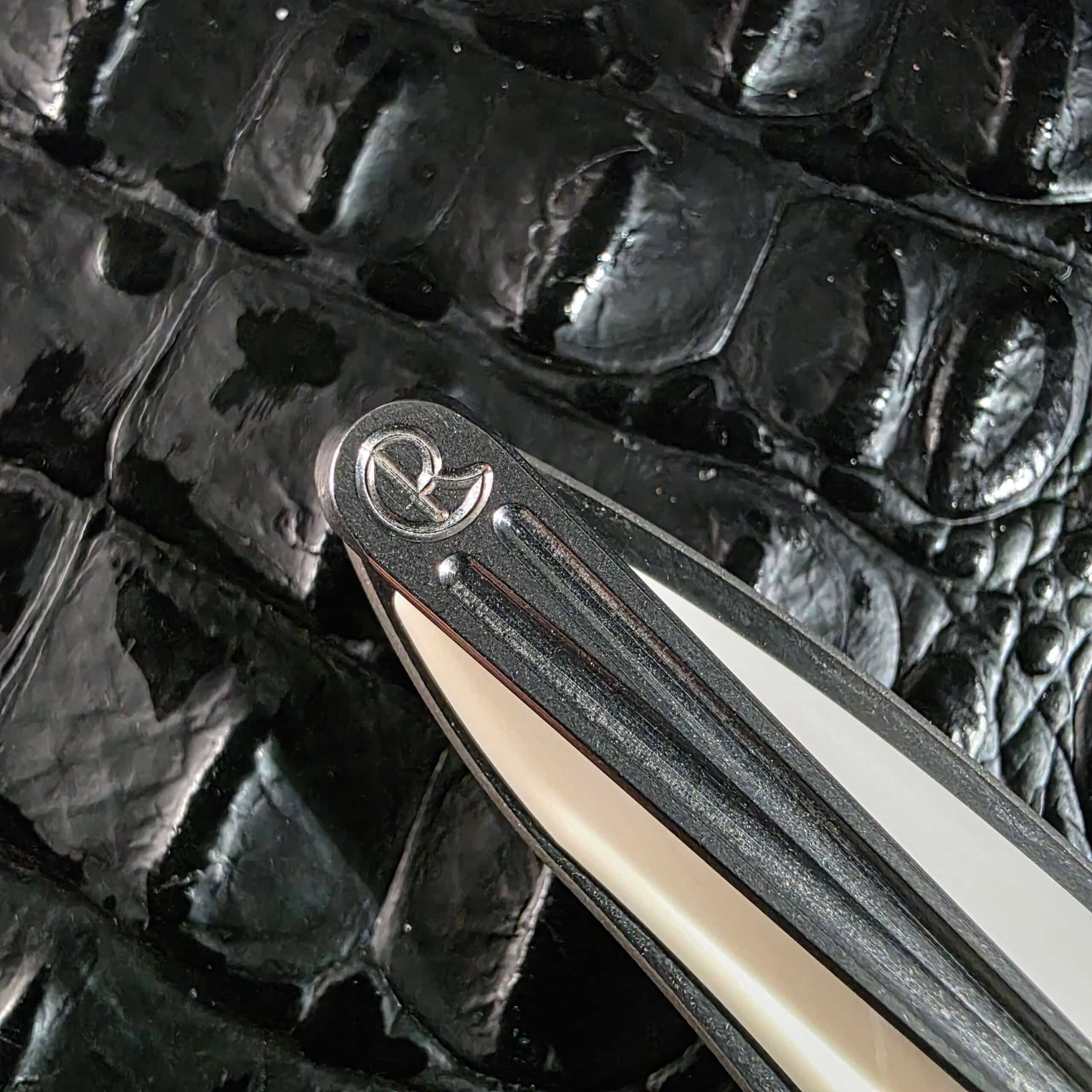 Chris Reeve logo stamped into the titanium butt end of the Mnandi beside the machined pocket clip