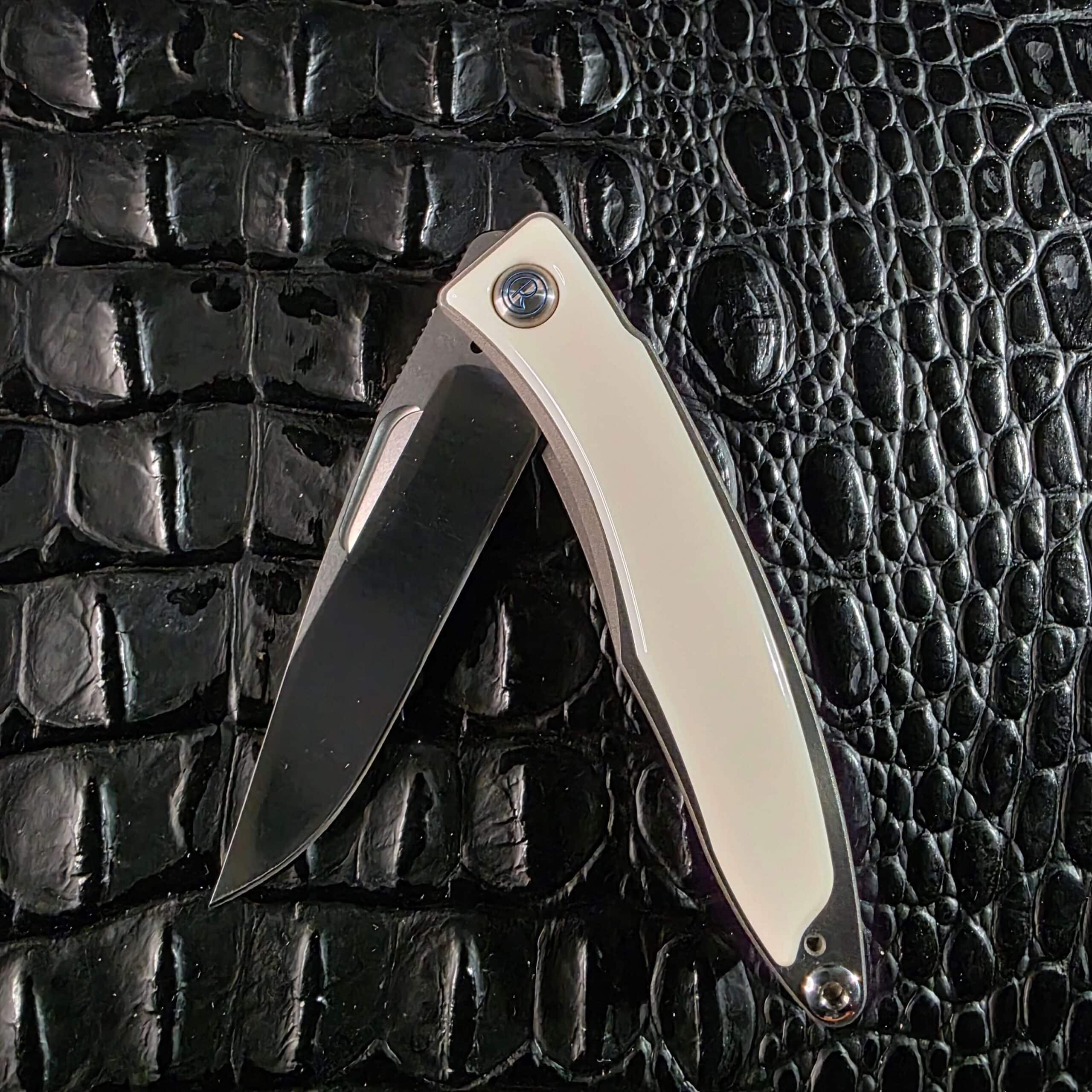 Chris Reeve Mnandi shown half open with the CPM S35VN blade clear of the mammoth ivory handle