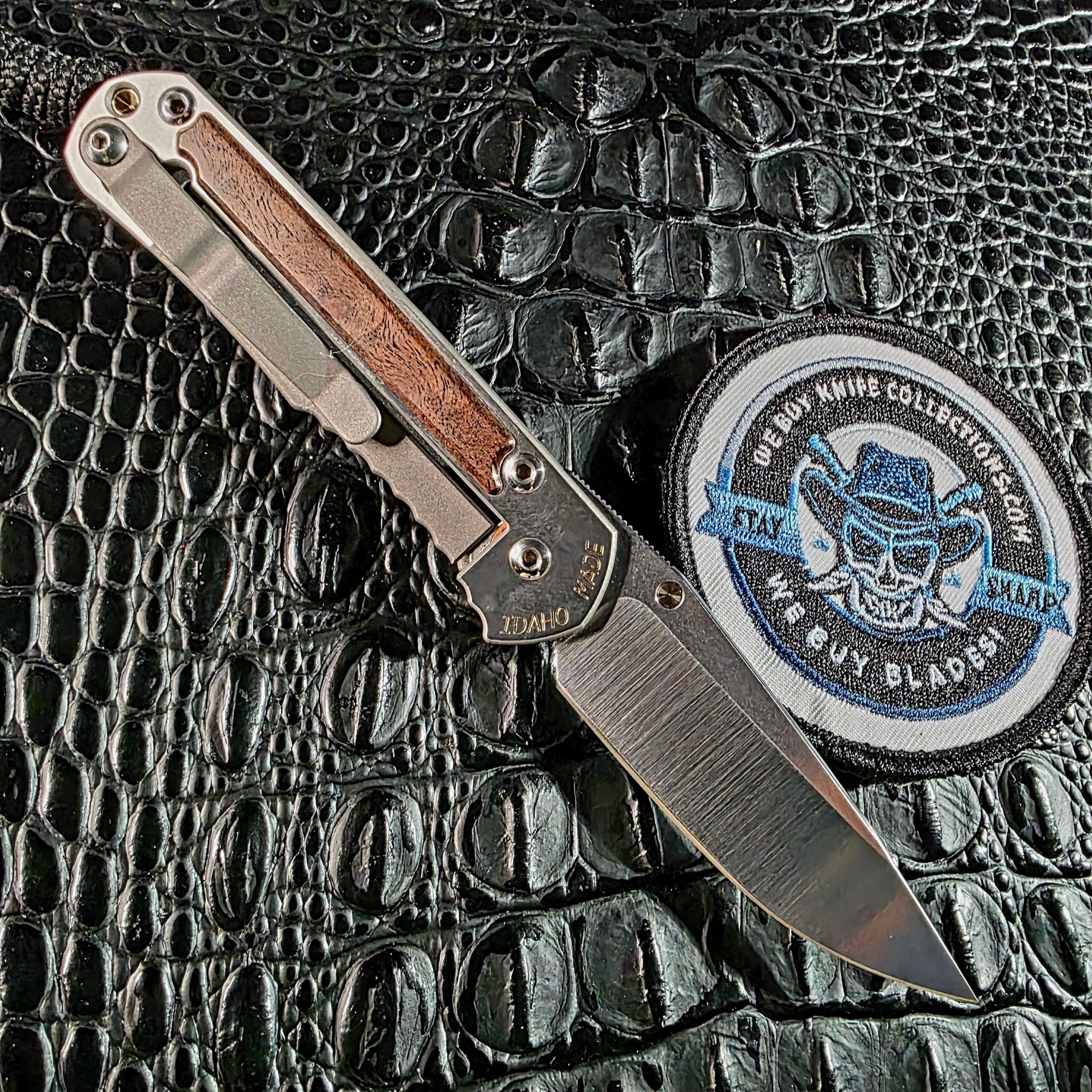 Lock side of the Chris Reeve Small Sebenza 2010 Annual showing the Idaho Made engraving, titanium pocket clip, and second camphor burl inlay