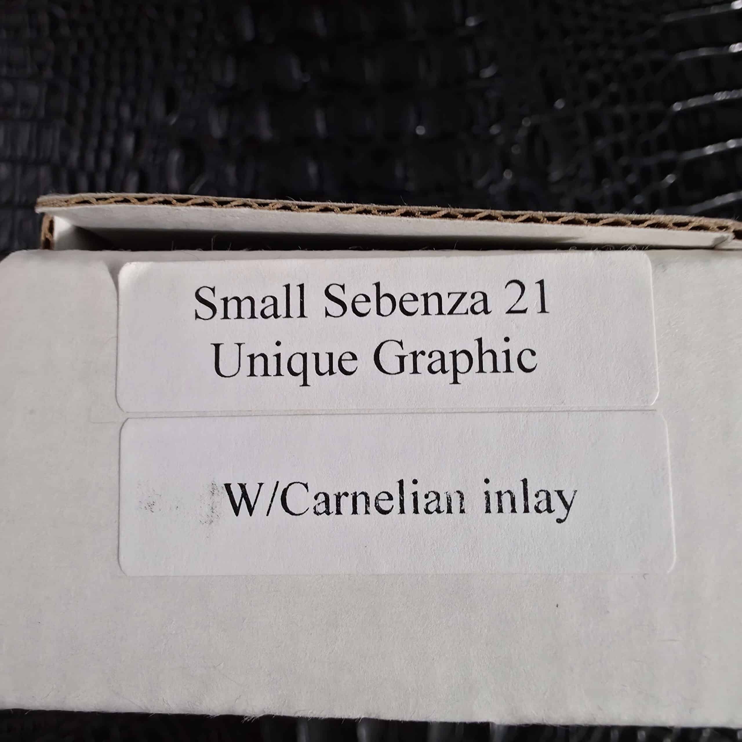 Factory box label reading Small Sebenza 21 Unique Graphic with Carnelian inlay