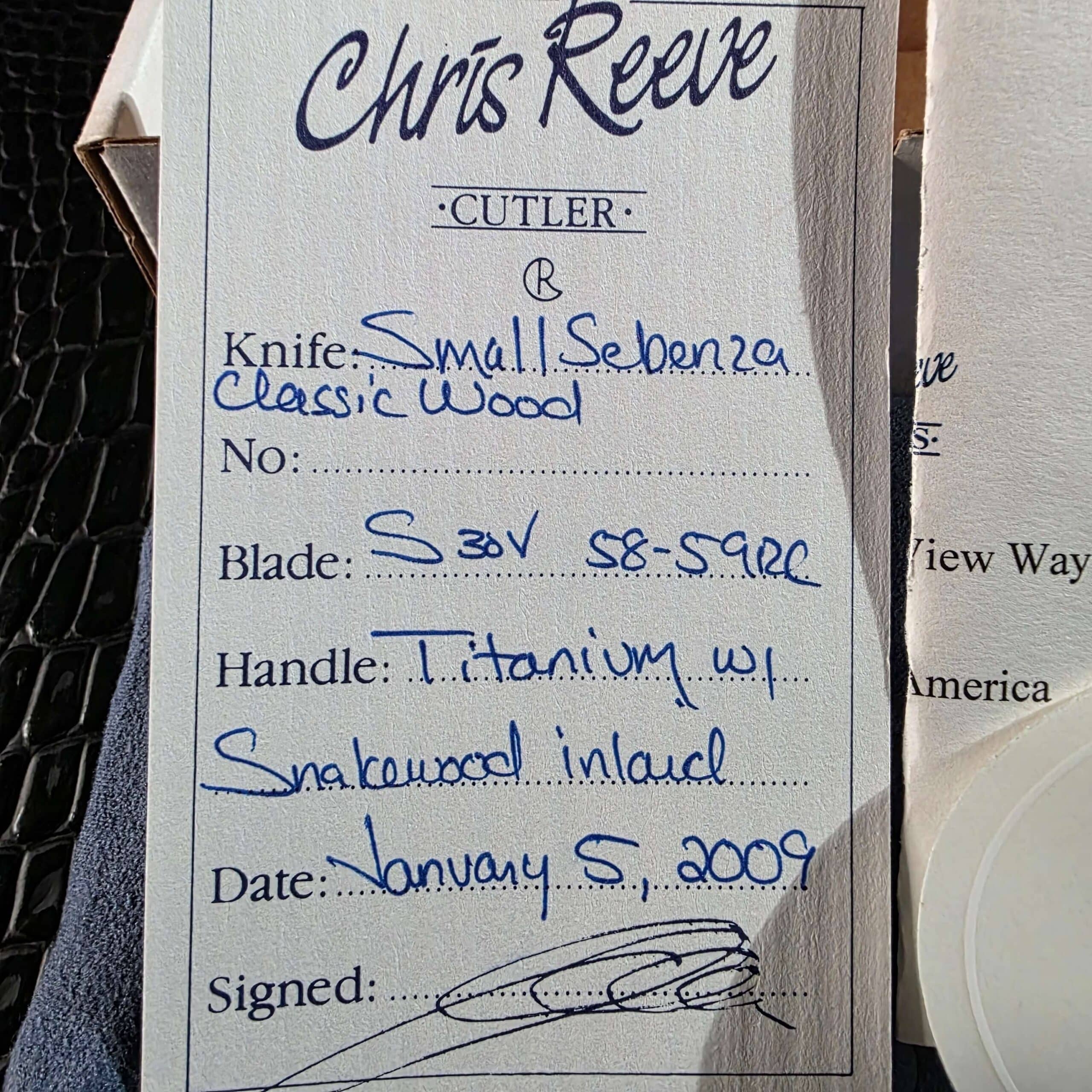 Signed Chris Reeve birth card for Small Sebenza Classic Wood dated January 5 2009