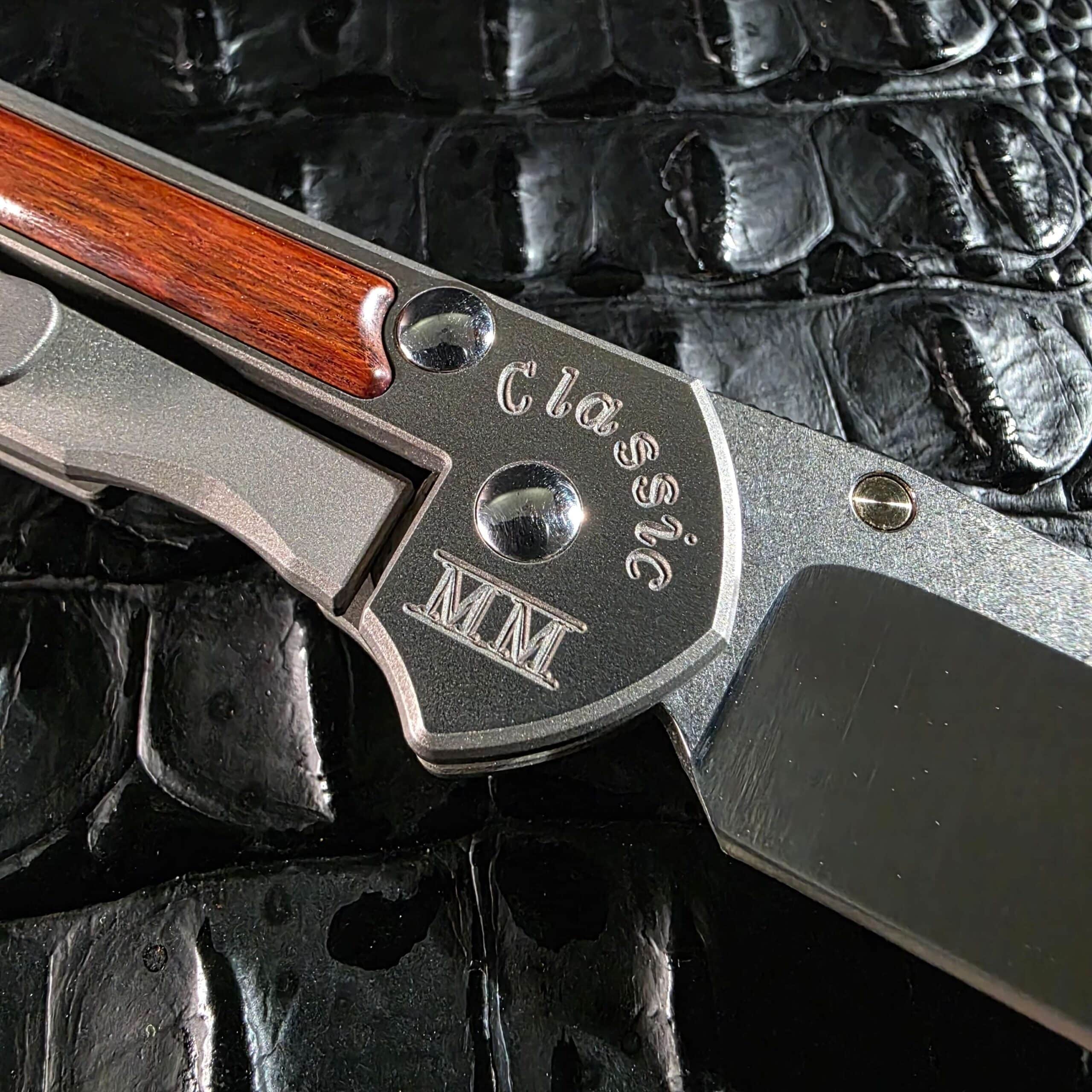 Classic MM engraving on Chris Reeve Small Sebenza titanium lock side