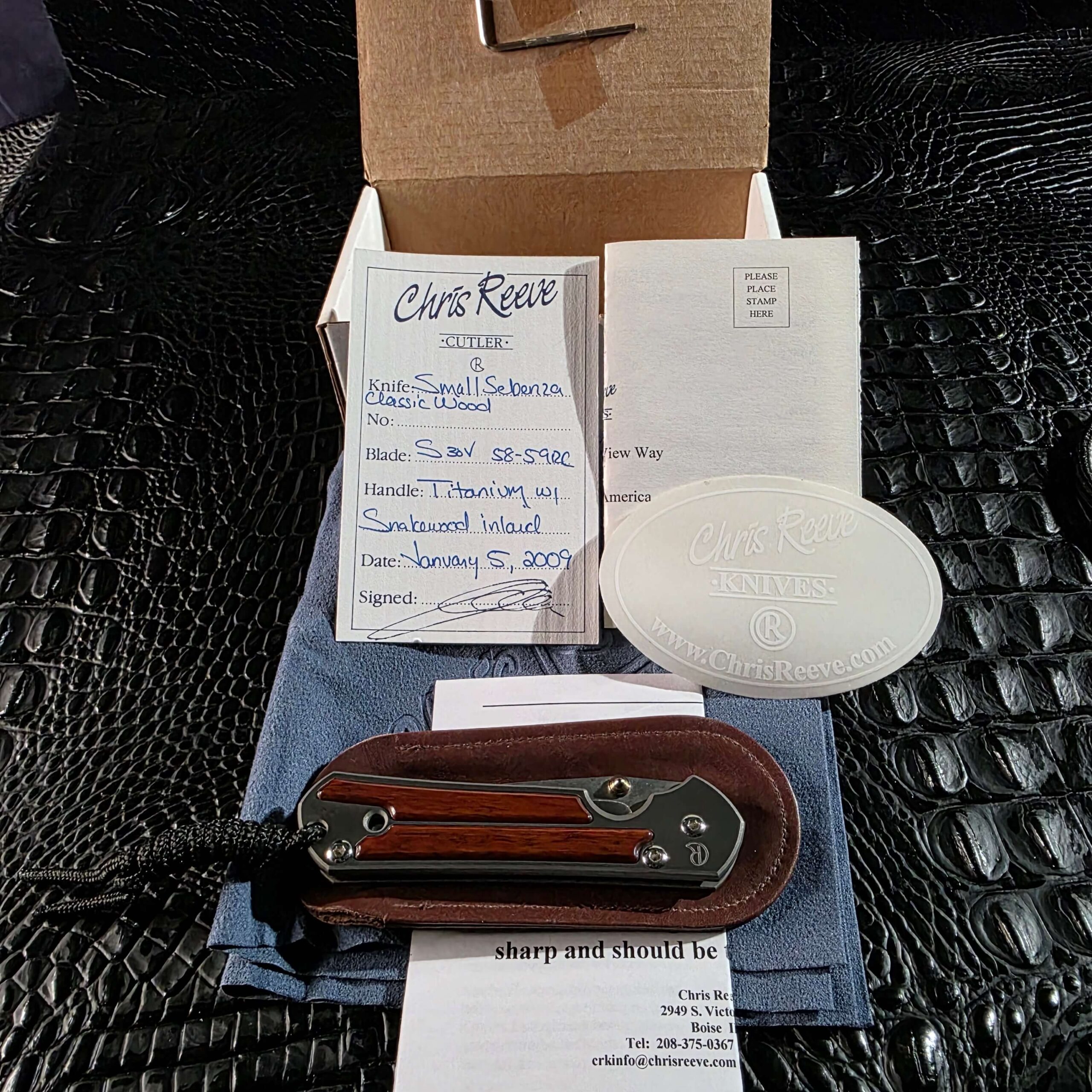 Chris Reeve Small Sebenza Classic Wood with complete original accessories including signed birth card, leather pouch, and box