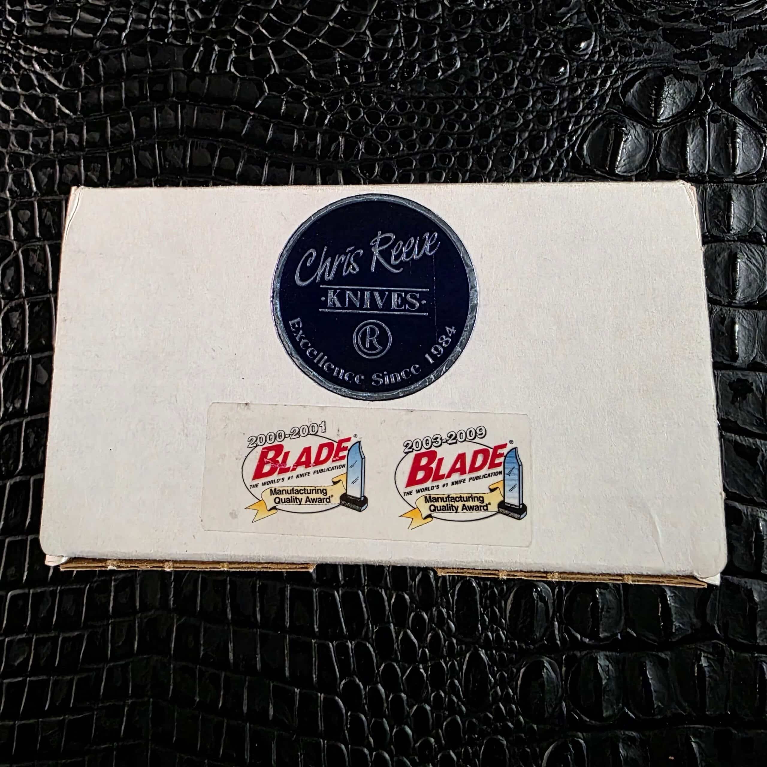 Original Chris Reeve Knives box with Excellence Since 1984 seal and BLADE Manufacturing Quality Award stickers