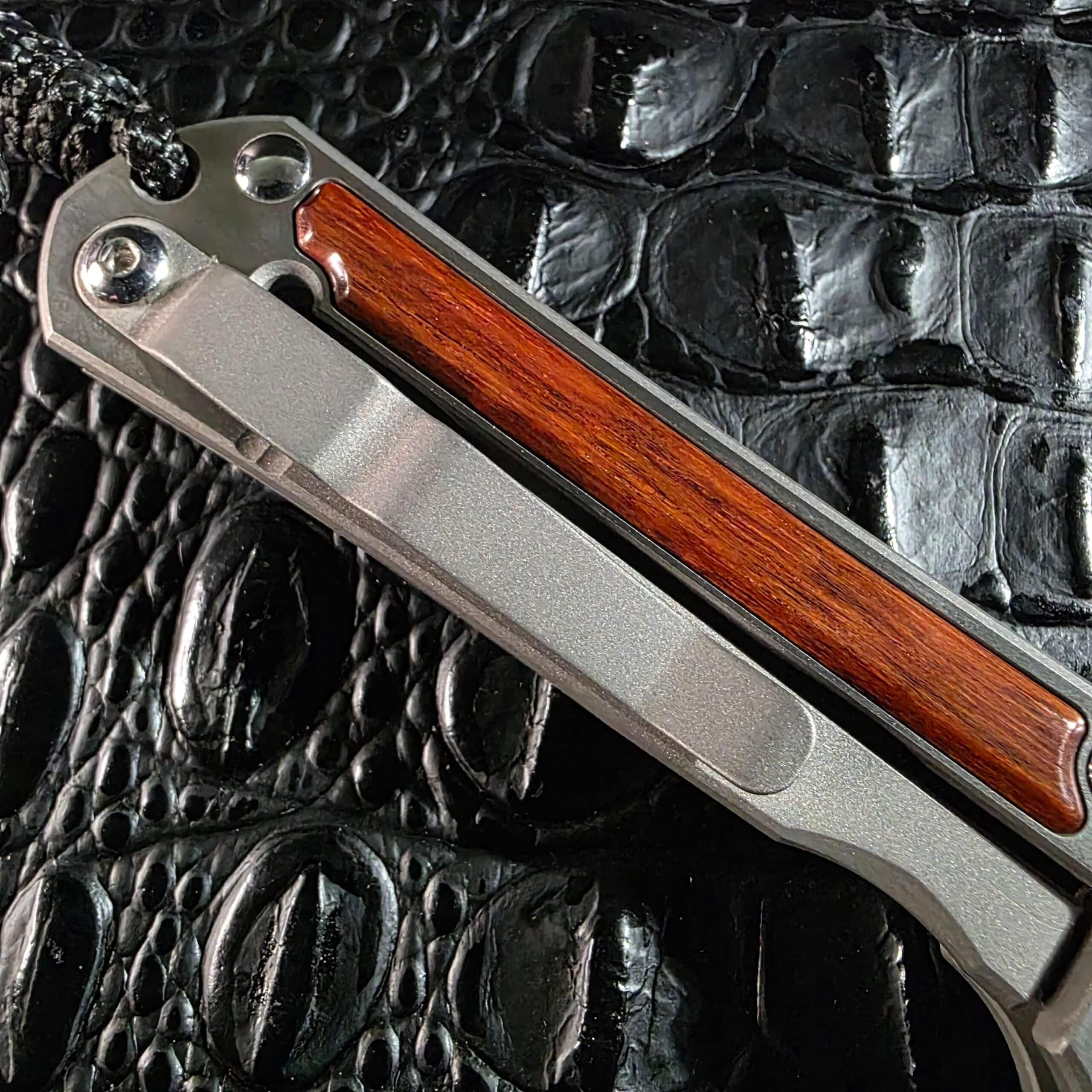 Titanium tip-up pocket clip on Chris Reeve Small Sebenza Classic Wood