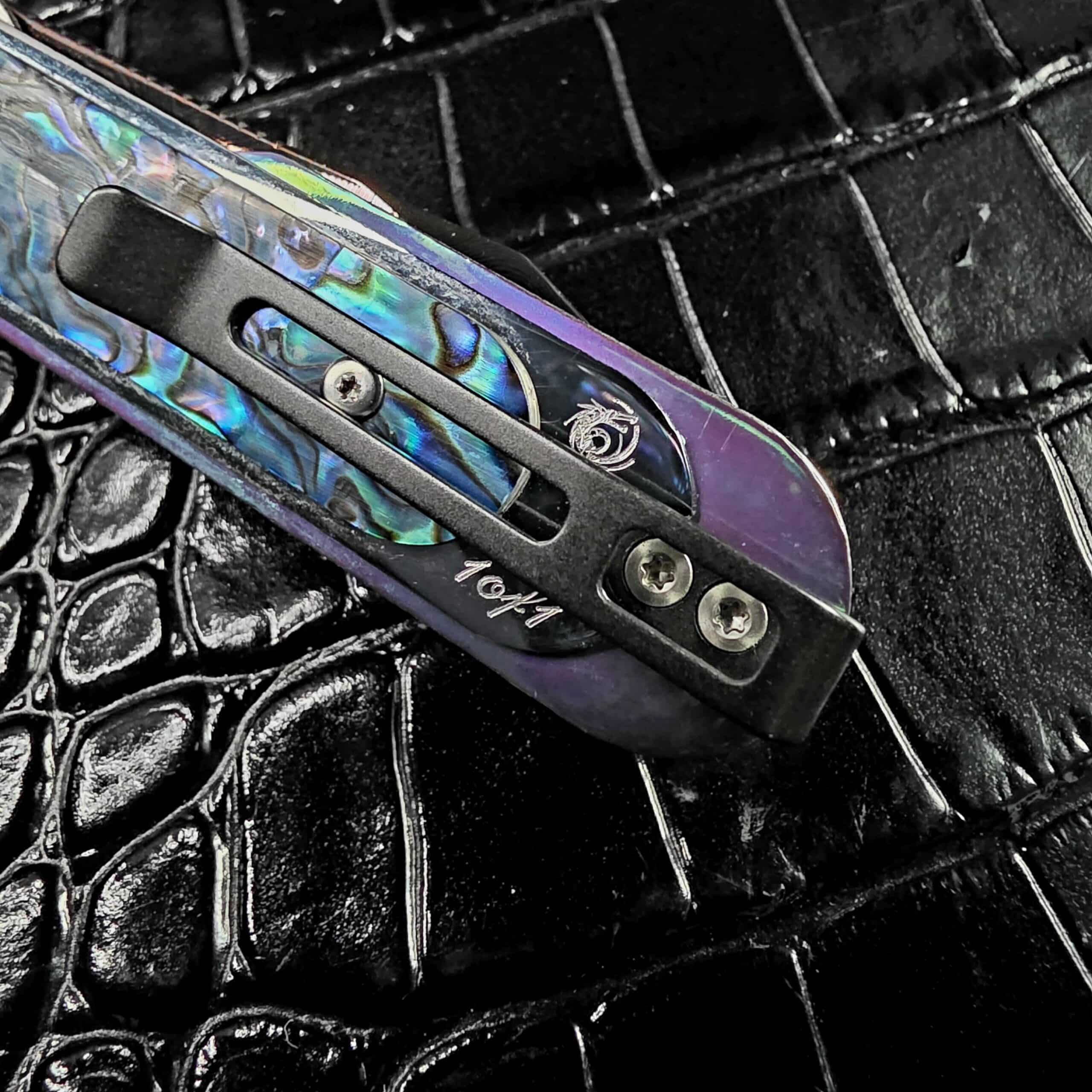 1of1 hand engraving and Dew Hara dragon logo on the pocket clip and scale