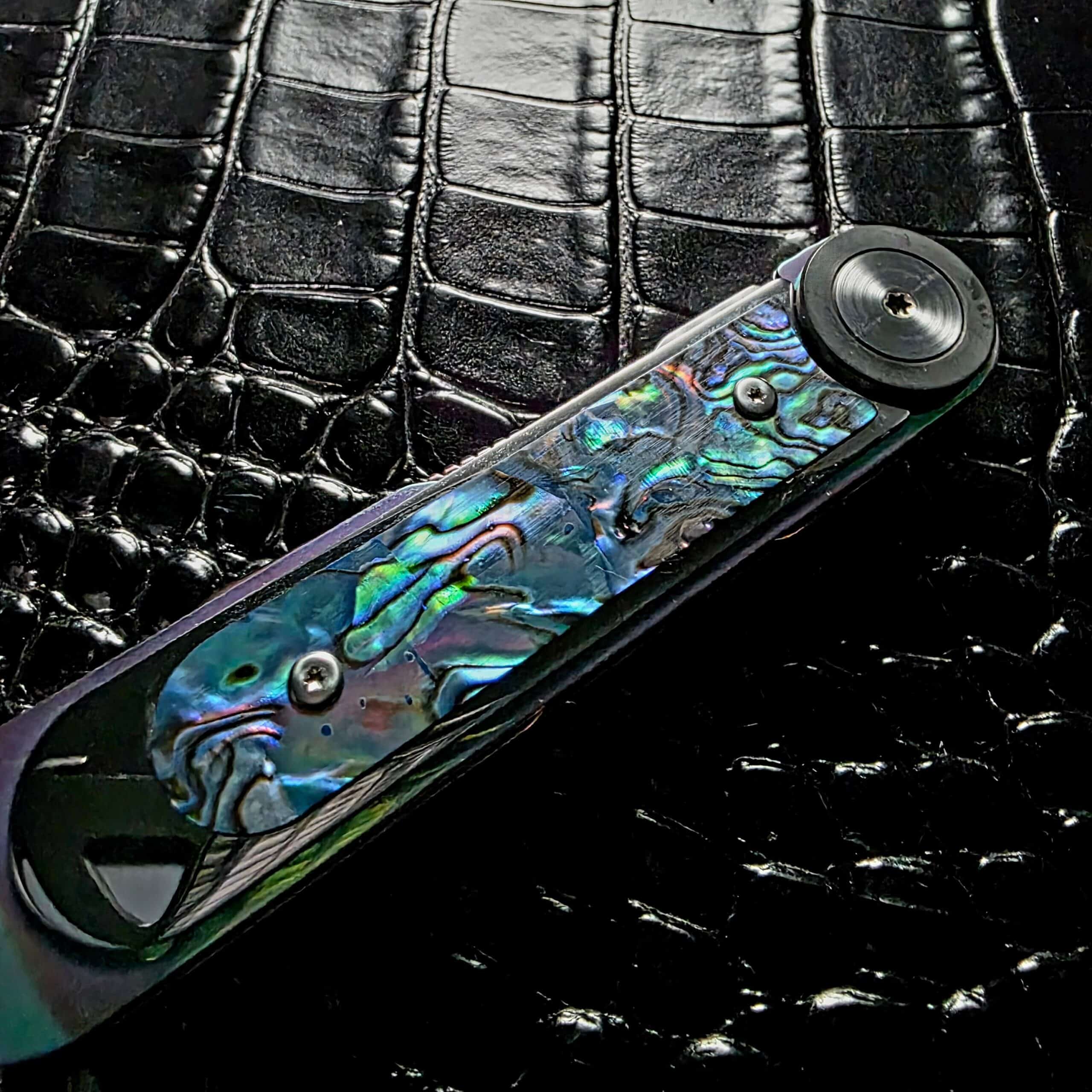 Natural abalone scale on the Dew Hara Infinity showing green and blue fire