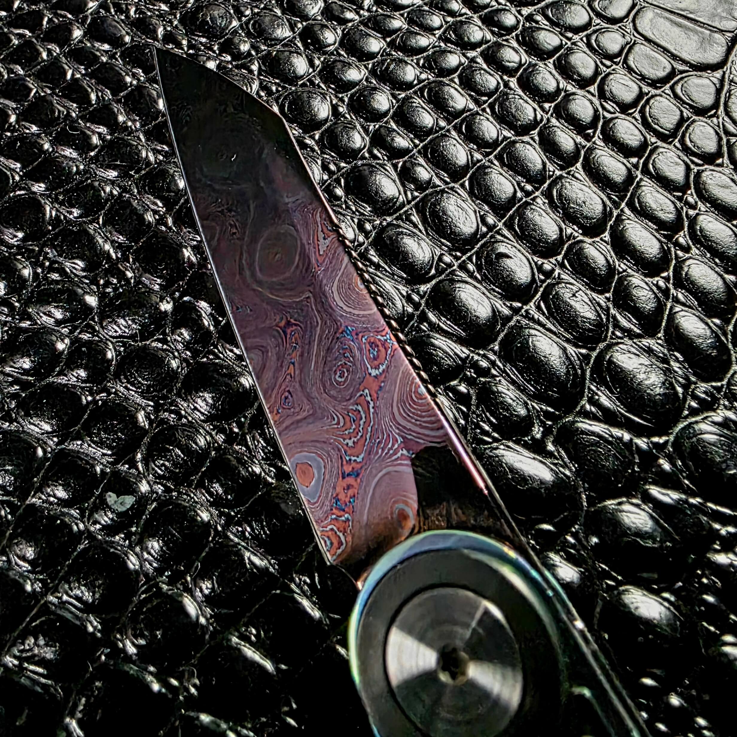 Concentric pyramid ring pattern in the damascus of the Dew Hara Infinity blade