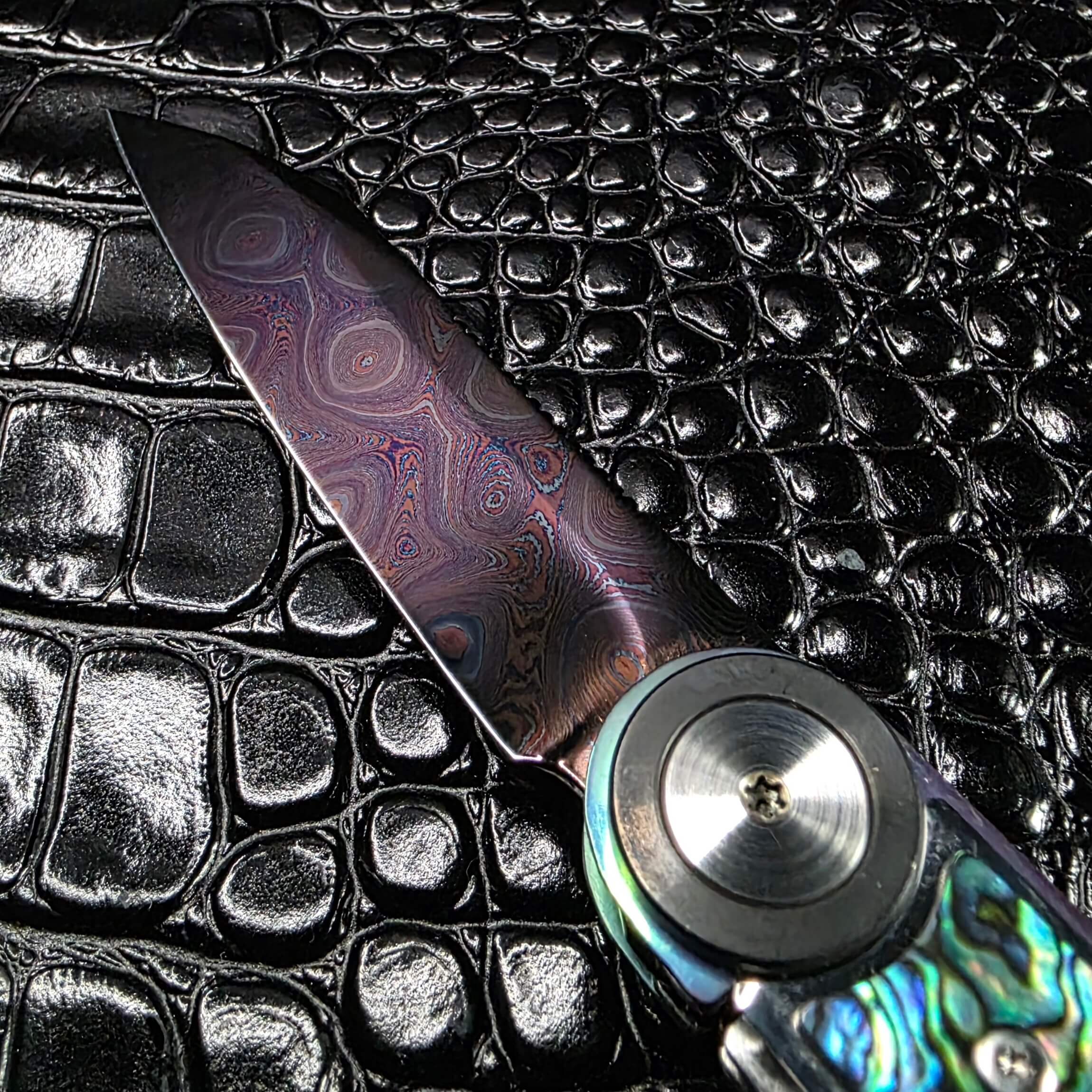150-layer Pyramid Carbon damascus blade on the Dew Hara Infinity, blued and polished