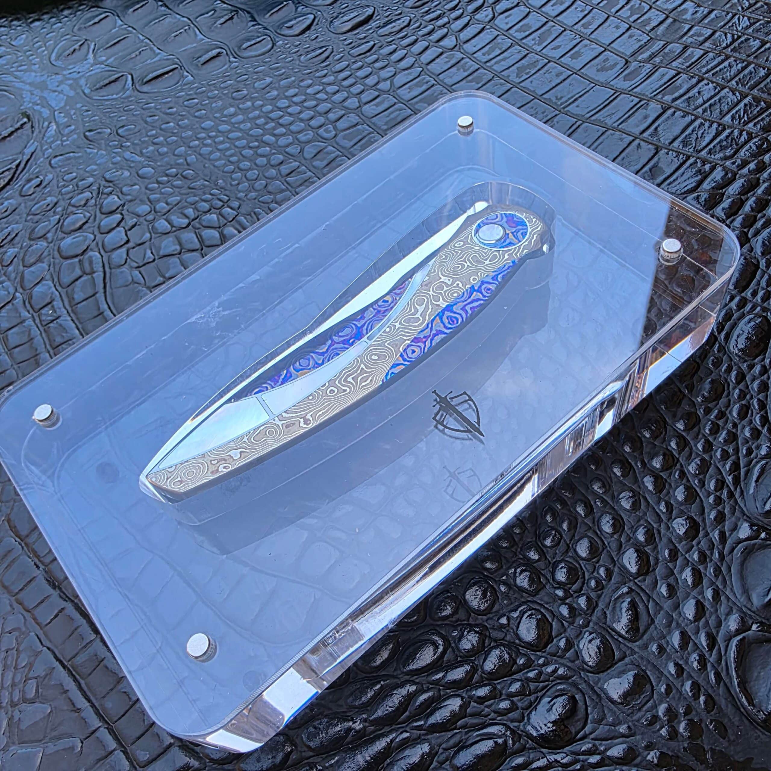 Angled view of the FengLi Jiao Yue Top Configuration in its acrylic display stand