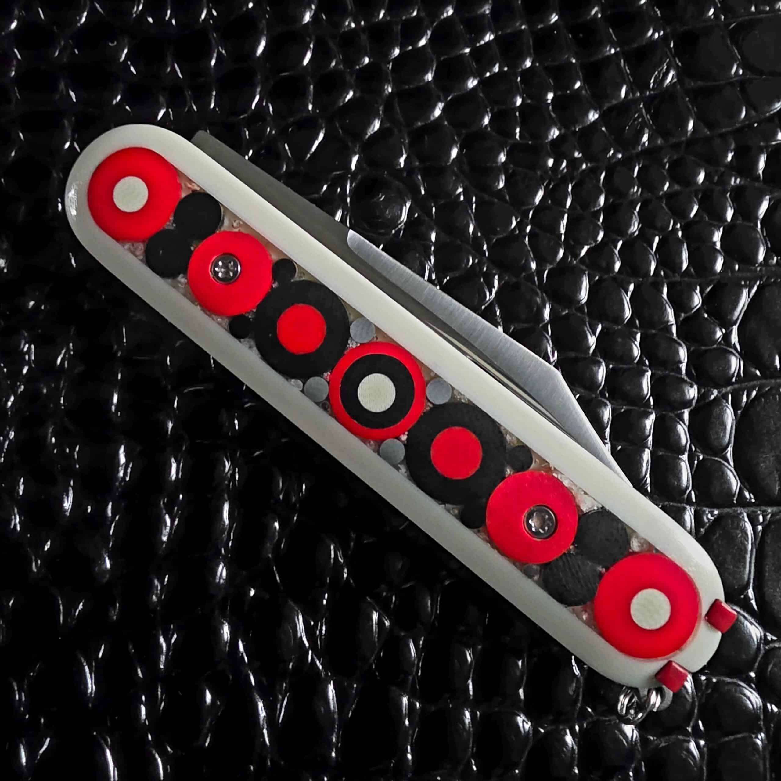 Chuck Gedraitis Switch Army Retro Edition closed showing the full hand-laid mosaic micarta pattern