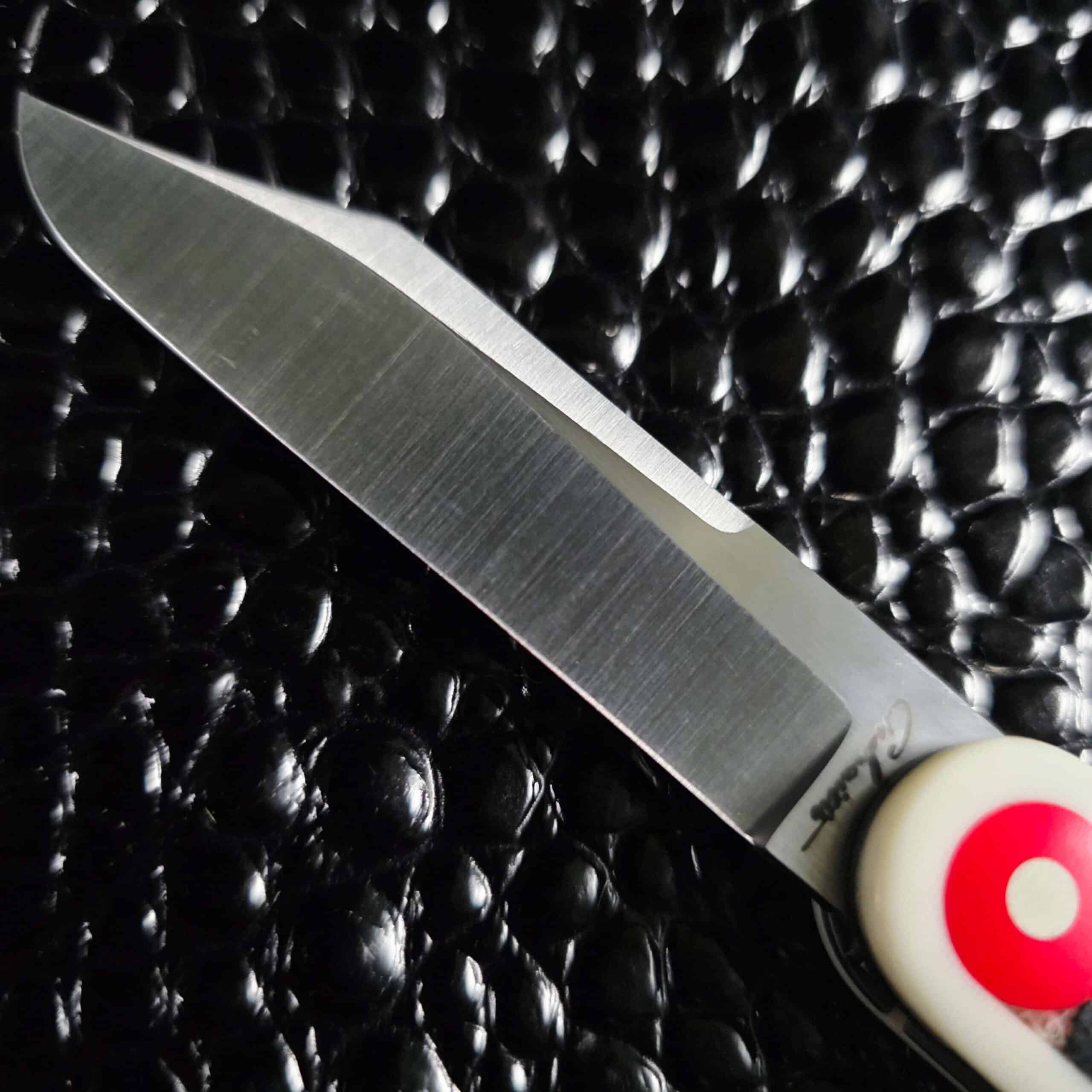 Gedraitis script etch on the satin Nitro-V blade of the Switch Army Retro Edition