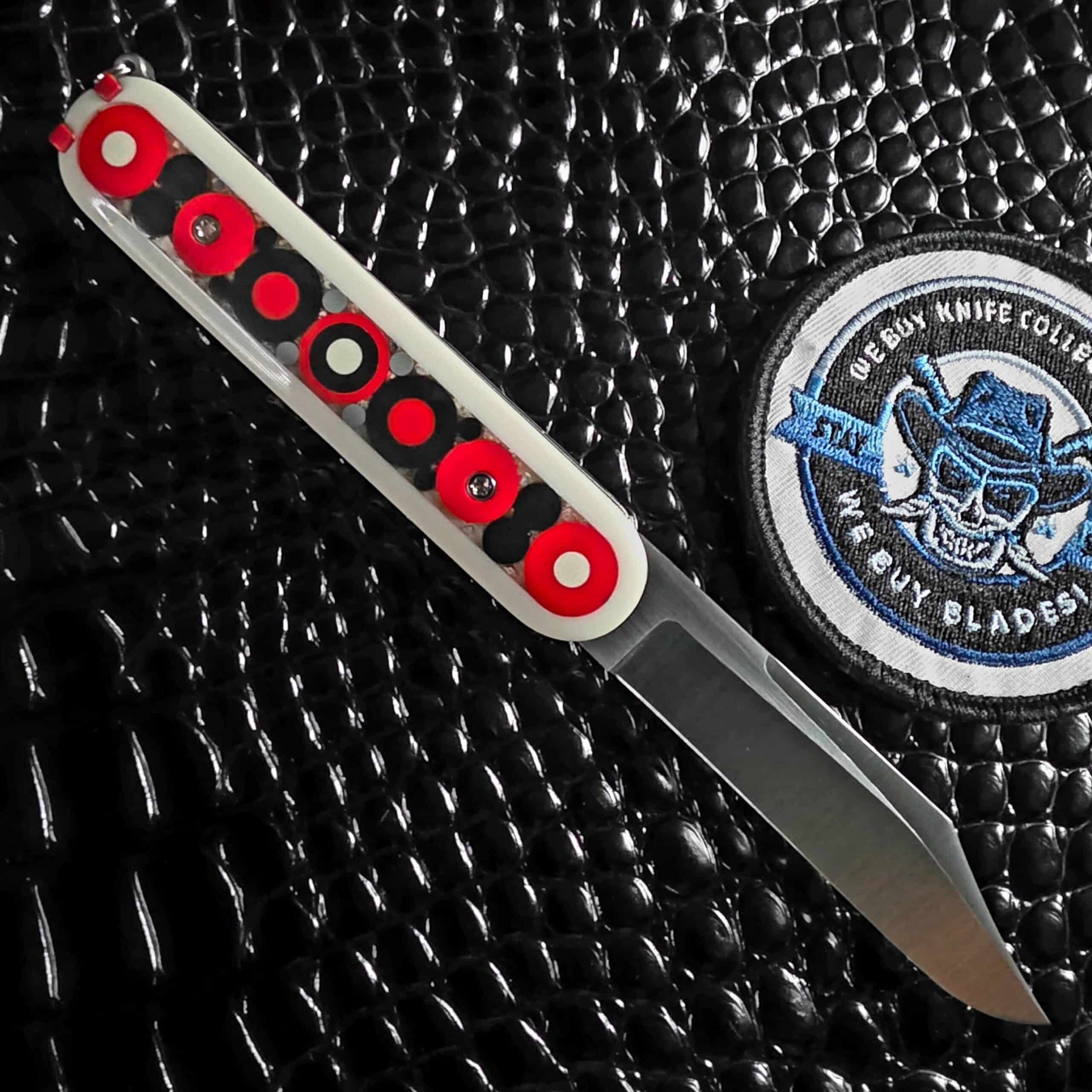 Chuck Gedraitis Switch Army Retro Edition open on the reverse scale with mosaic micarta and satin Nitro-V blade