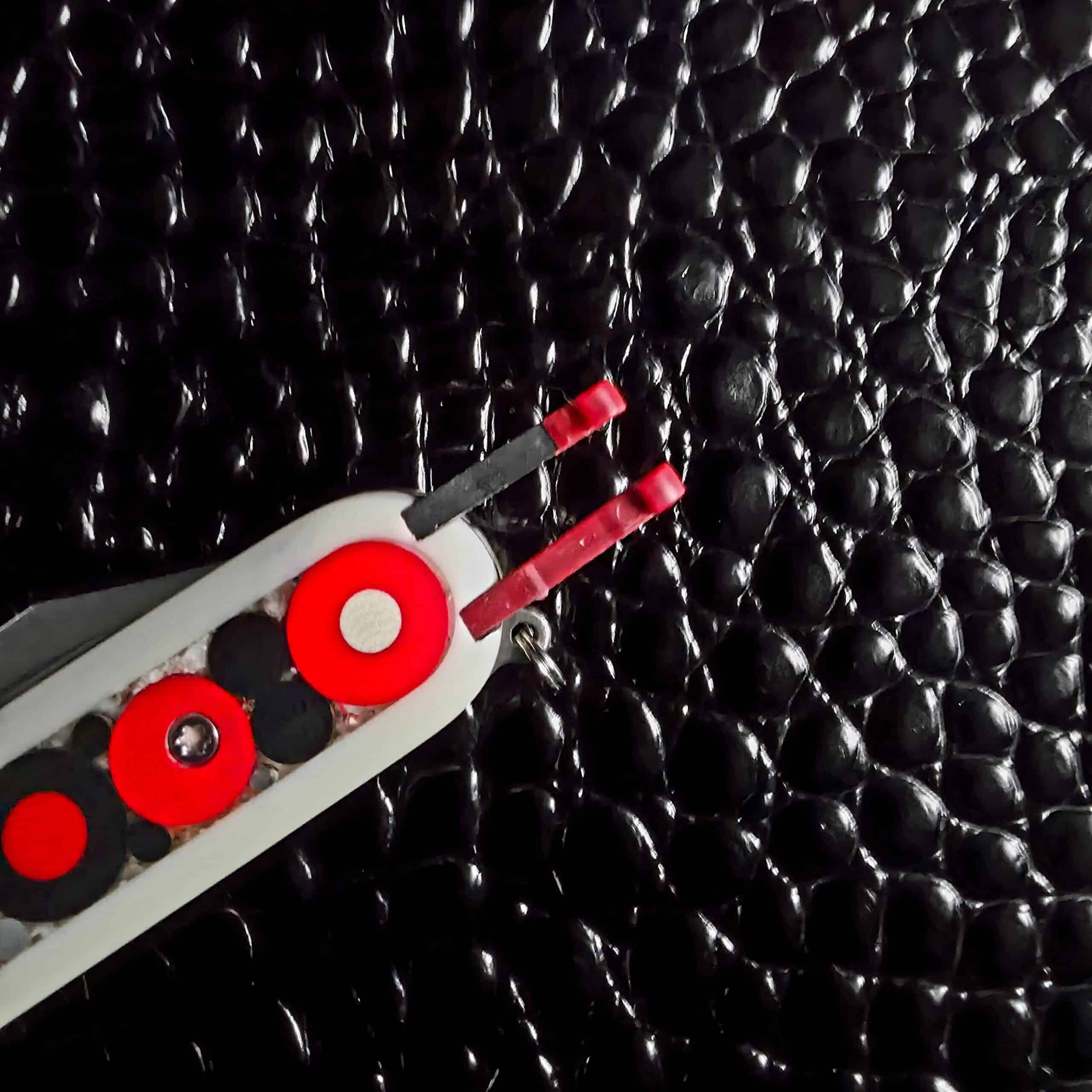 Toothpick and tweezers seated in the handle of the Chuck Gedraitis Switch Army Retro Edition