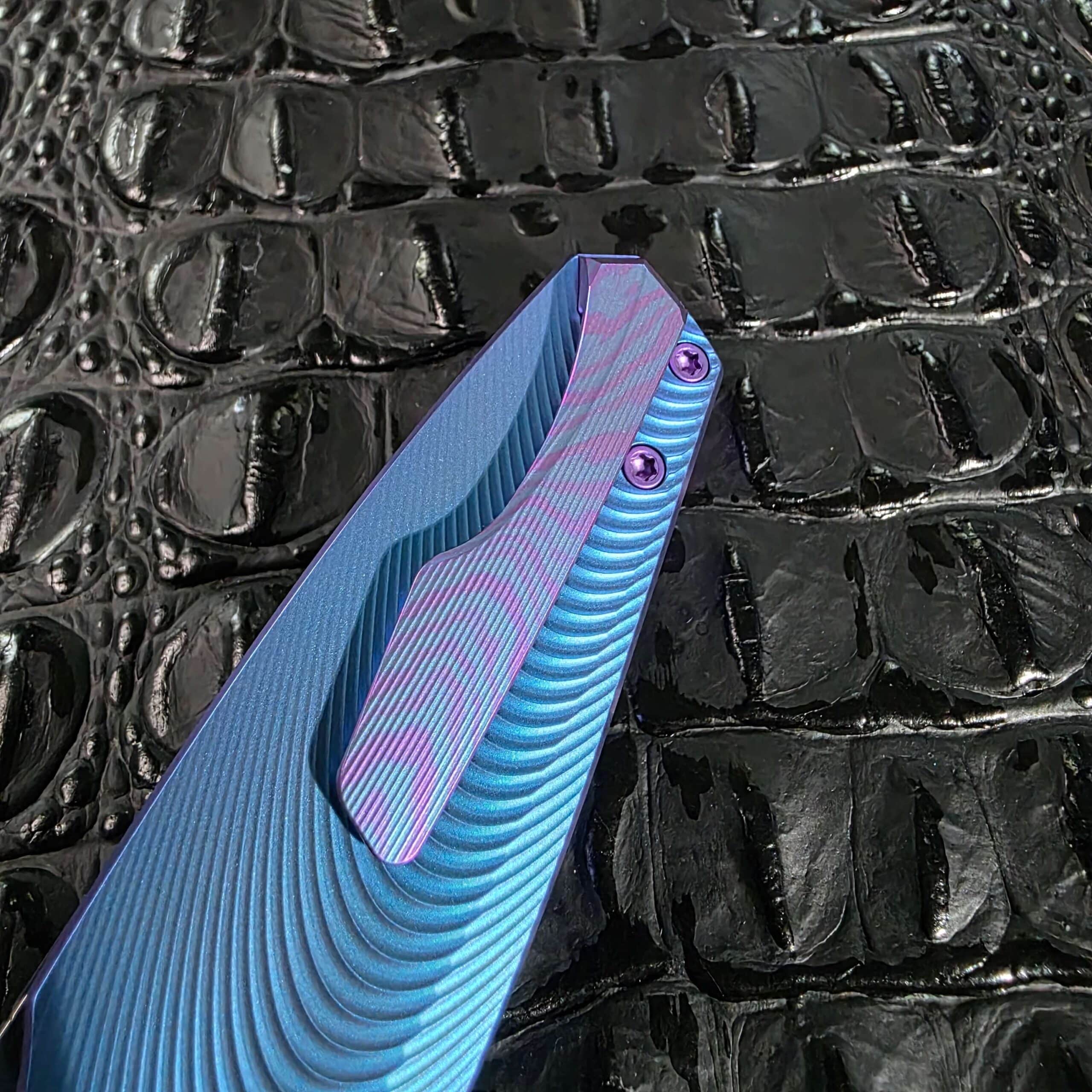 Close detail of the burnished anodized titanium pocket clip on the Holt Bladeworks Morpheus #1856