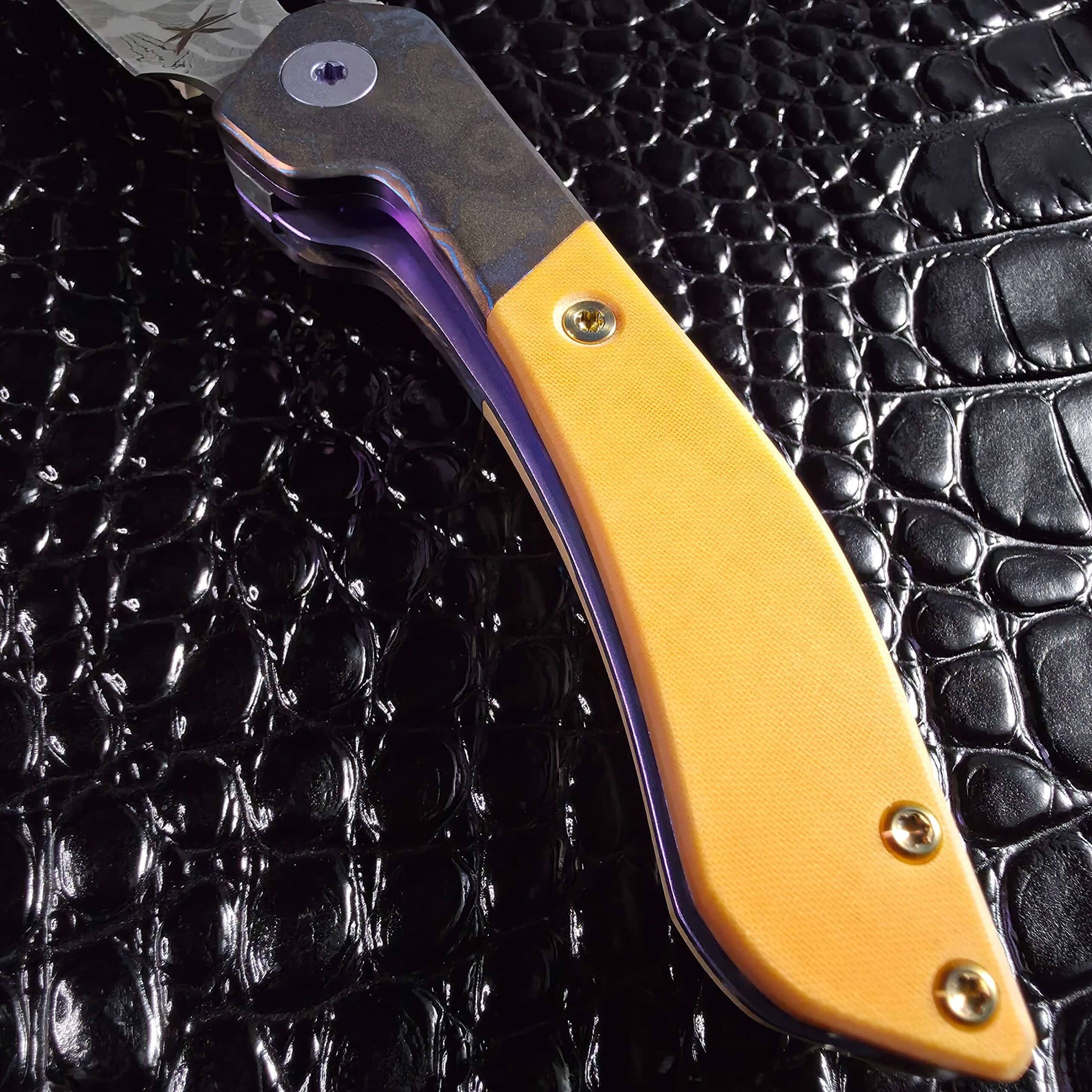 Handle contour and bolster to scale transition on a Keanison Bloodhound liner lock Image Title: Keanison Bloodhound Liner Lock #15 Handle Contour