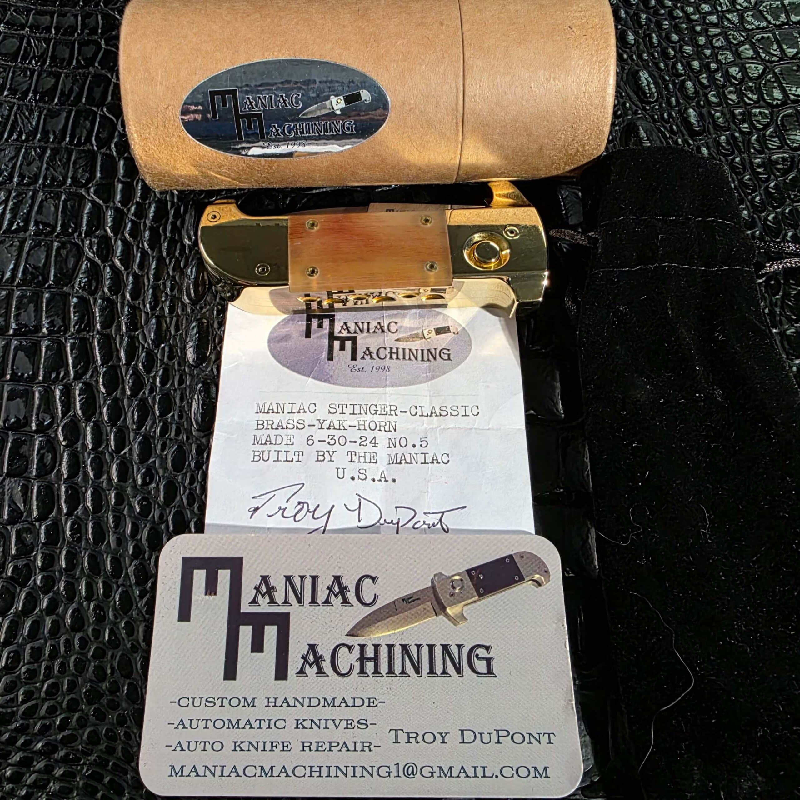 Maniac Machining Stinger Classic with leather storage tube, velvet pouch, signed C.O.A., and maker's card
