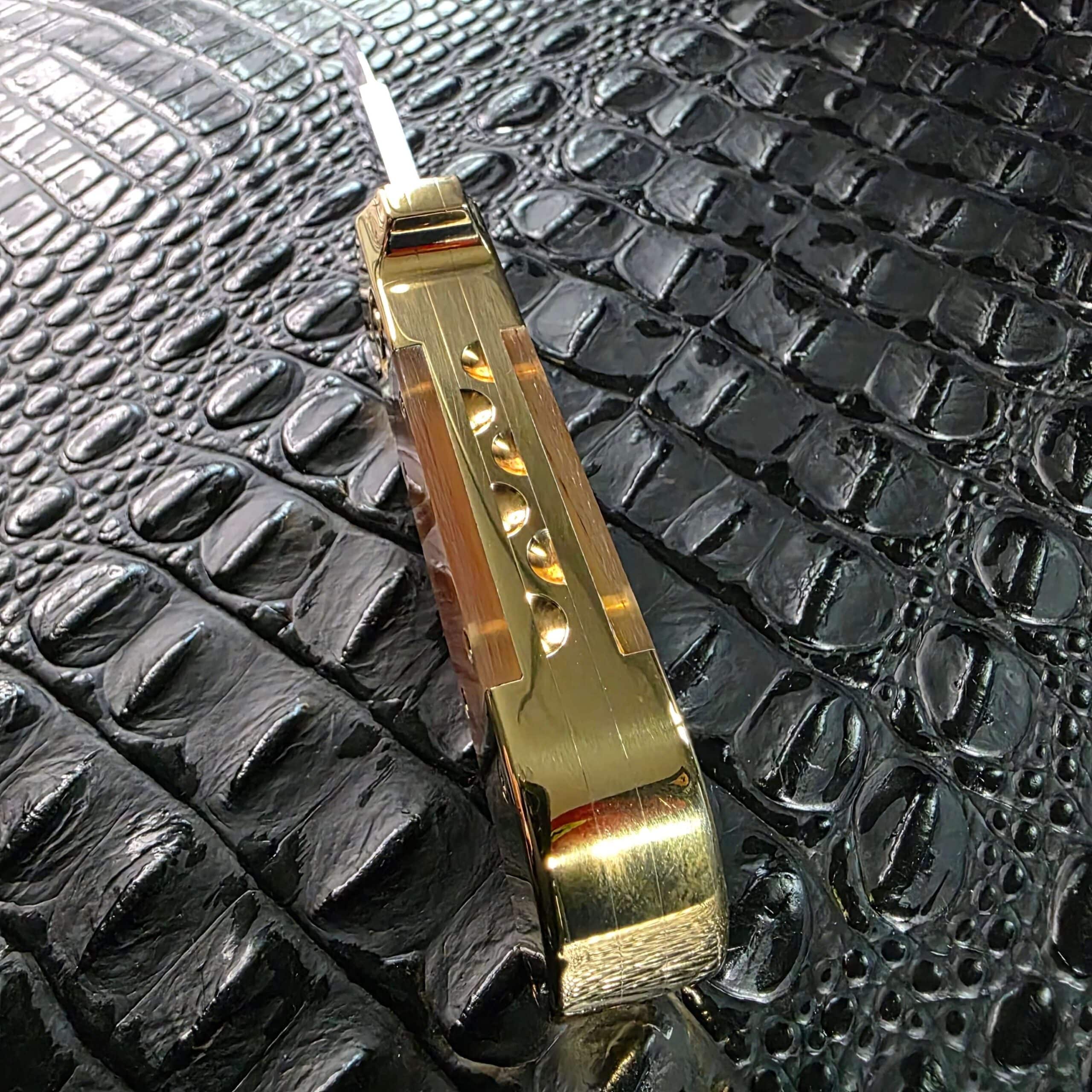 Milled scalloped spine work on the brass frame of the Maniac Machining Stinger Classic