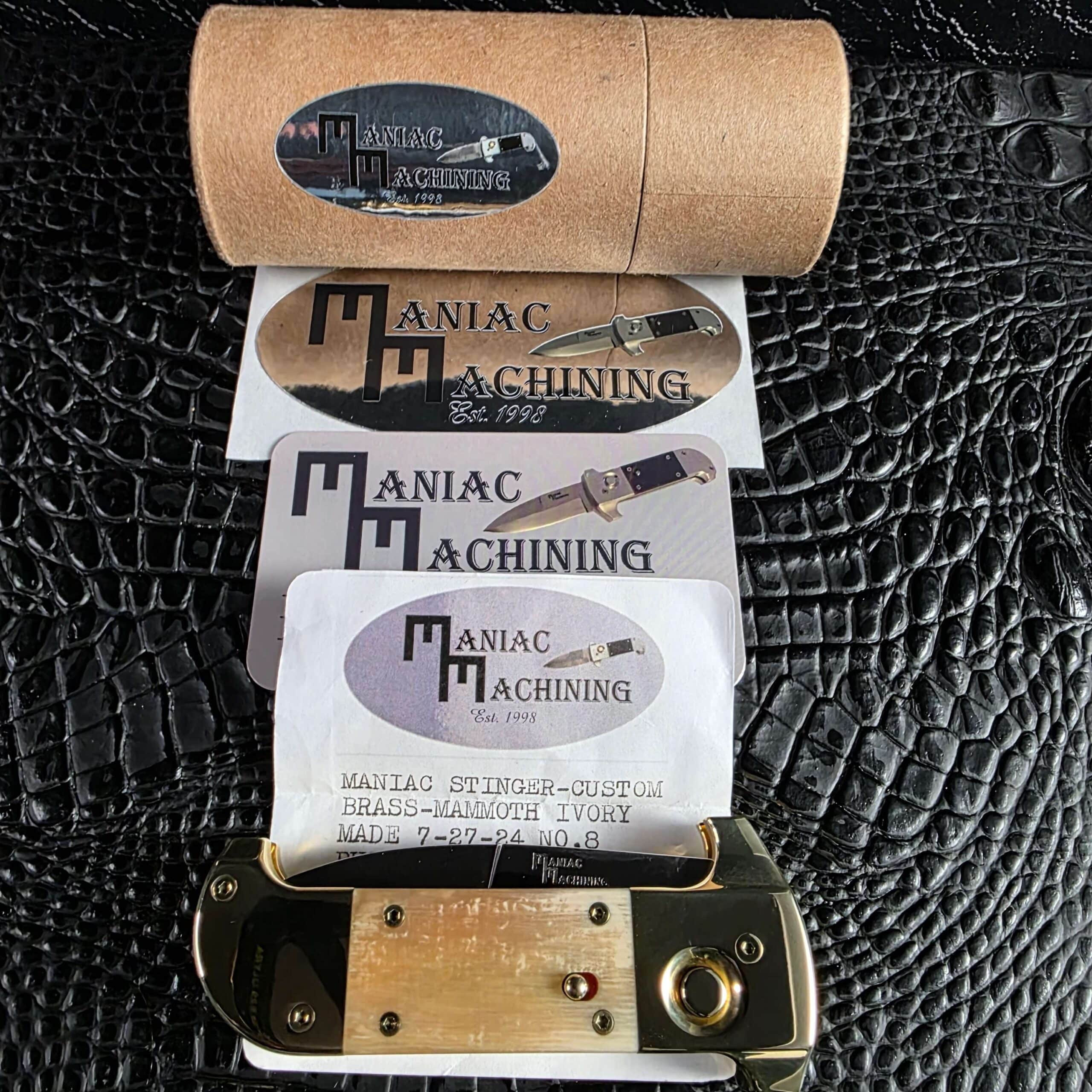 Maniac Machining cylinder presentation tube with decals, contact card, certificate and knife