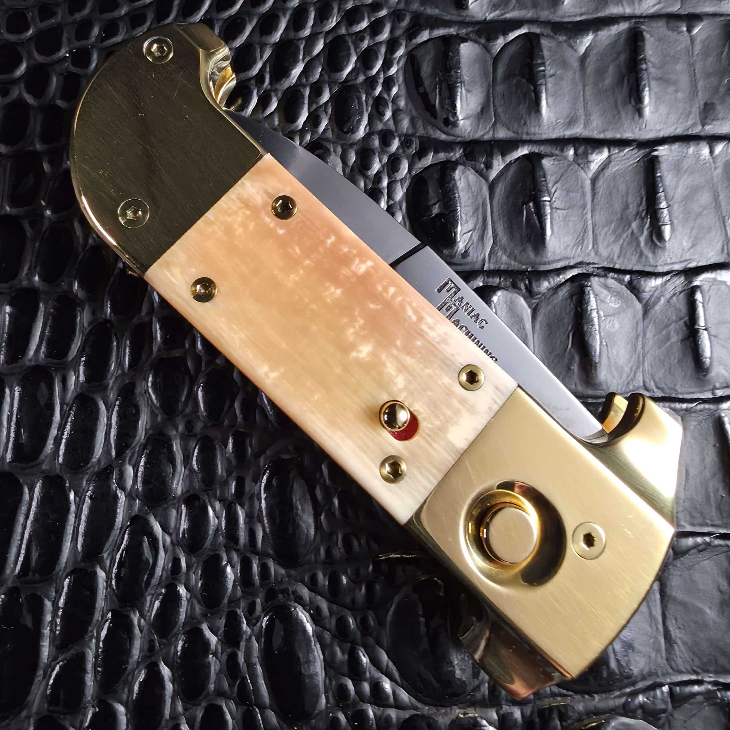 Full closed profile of the Maniac Machining Stinger Custom brass and mammoth ivory automatic