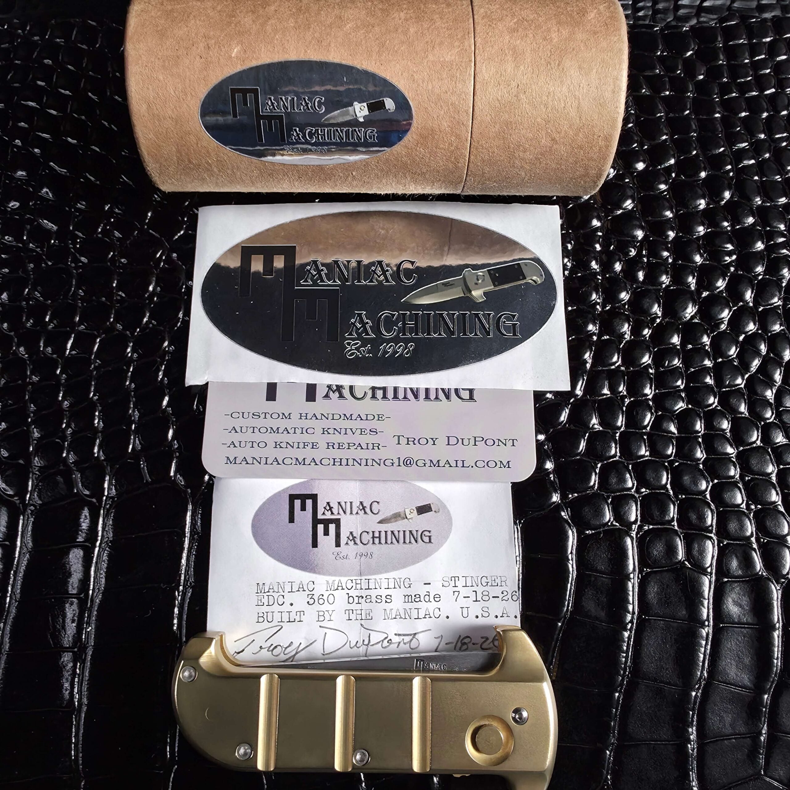 Maniac Machining cylinder tube, decal, warranty card and certificate with the Stinger EDC