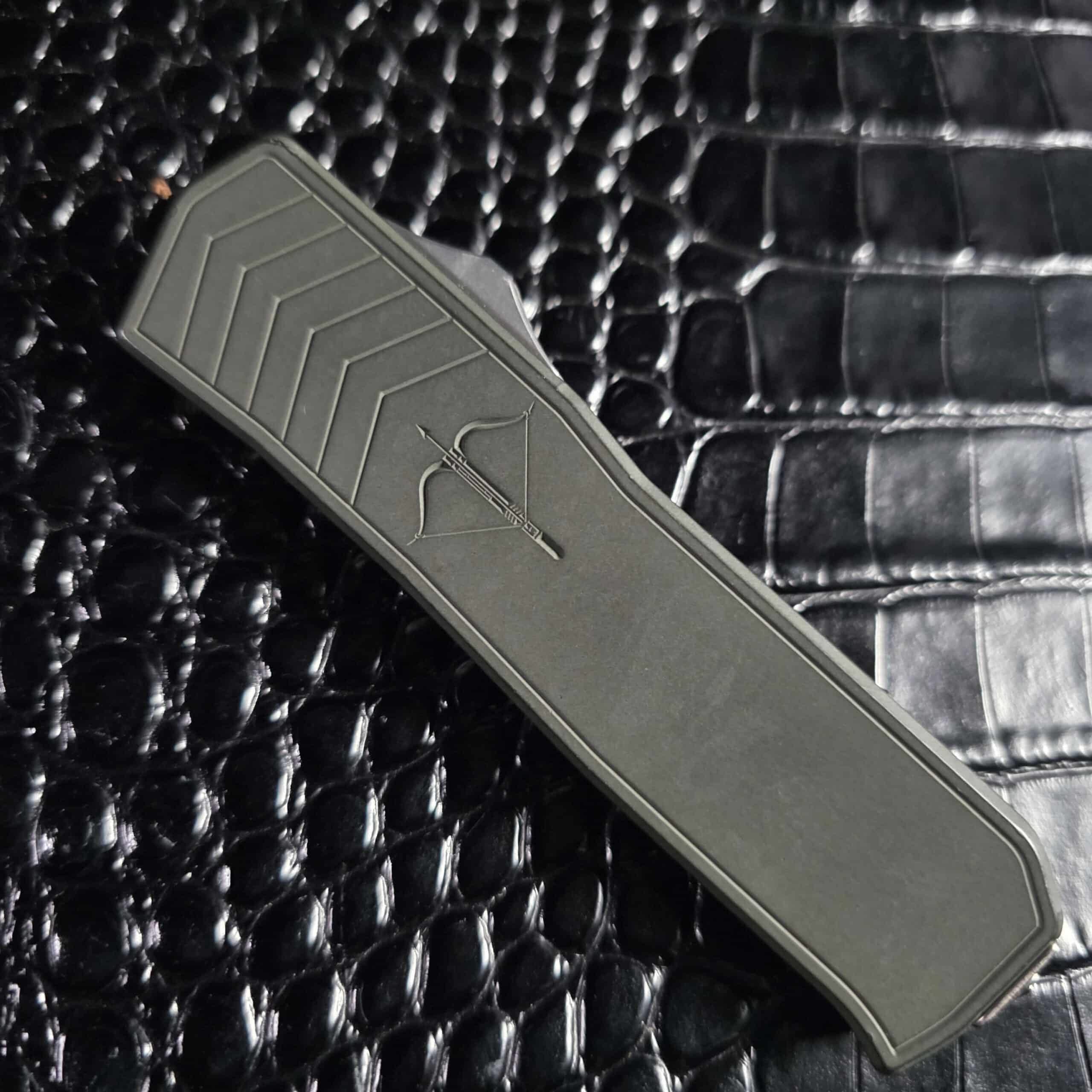Medford Merc-1 OTF closed on the show side, chevron milling and crossbow engraving