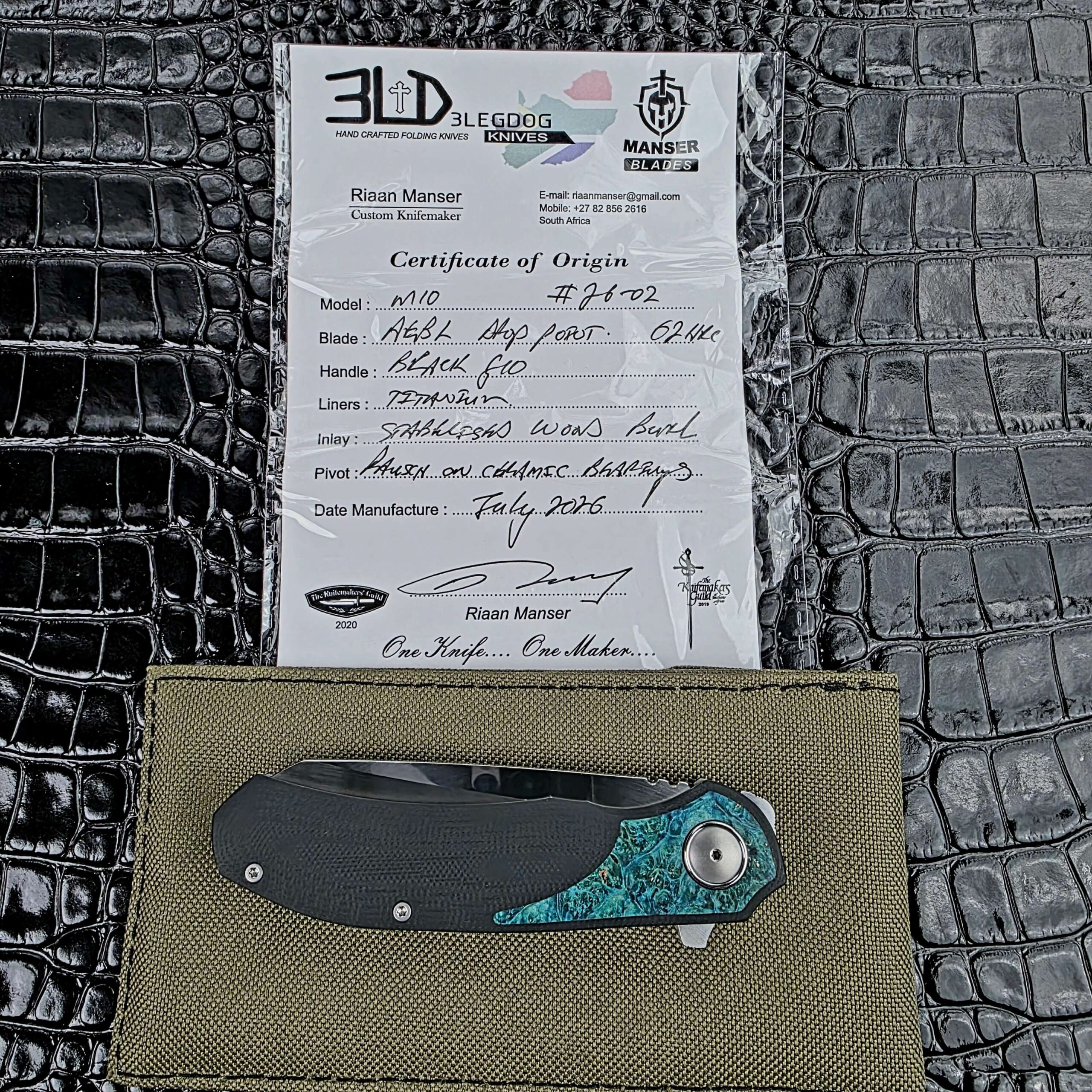 3LegDog M10 with its signed Certificate of Origin and maker's pouch