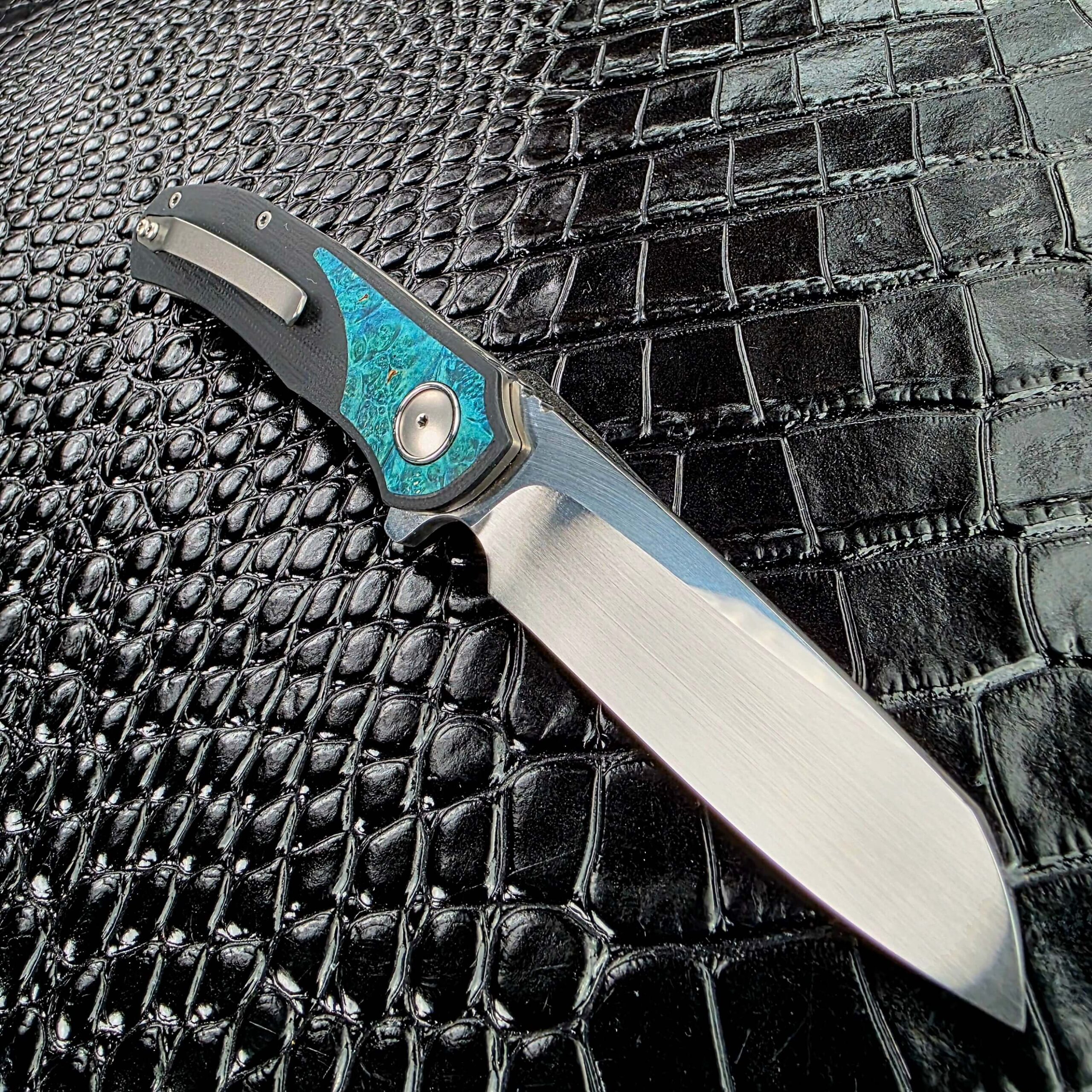 3LegDog M10 open on the clip side showing the titanium pocket clip along the G10 handle