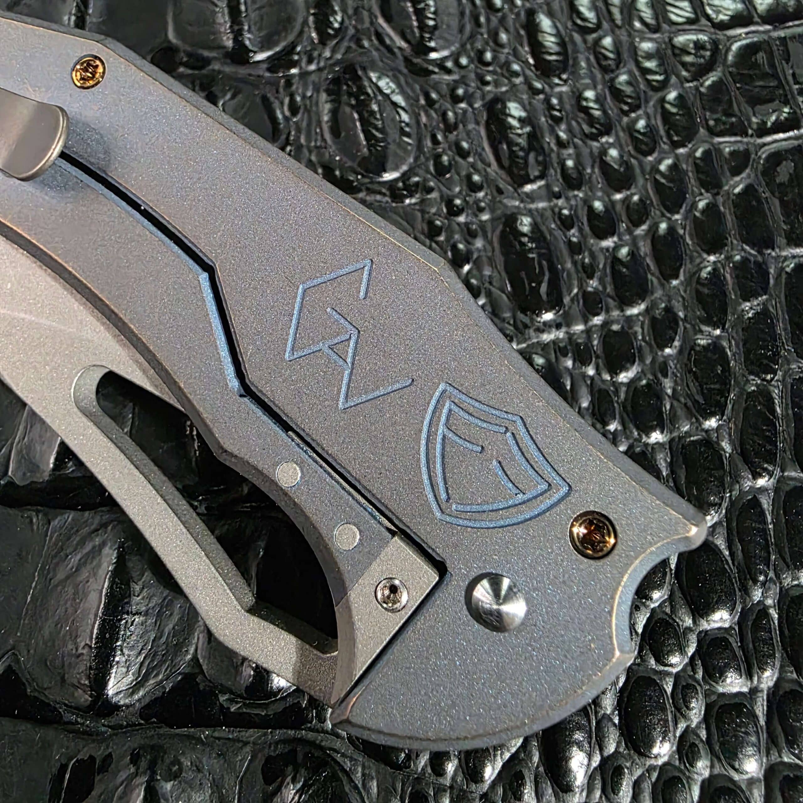 Ferrum Forge Gavko Spinner closed on the clip side with sculpted titanium pocket clip