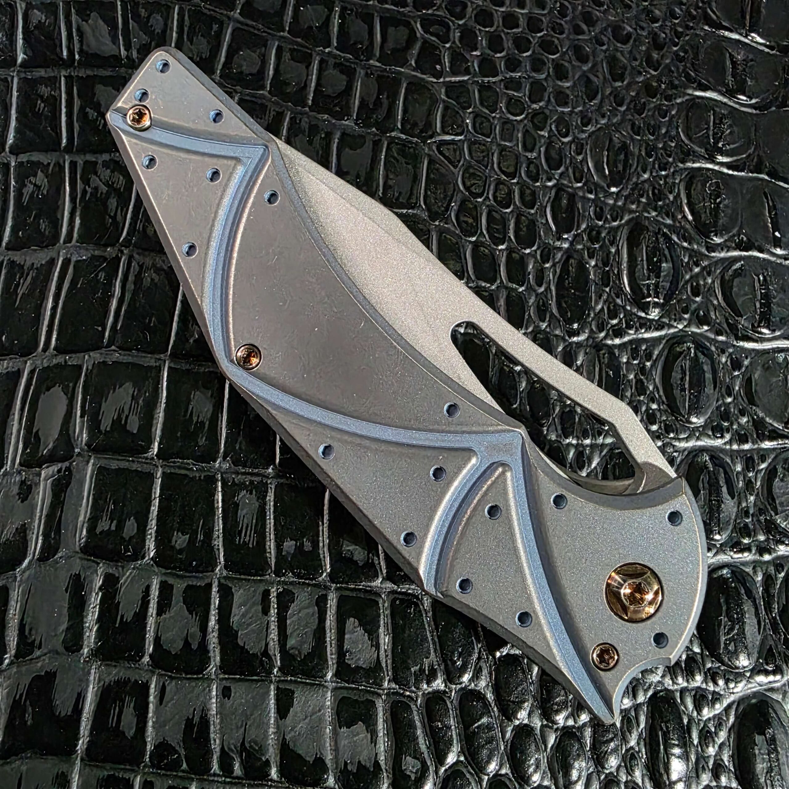 Open Ferrum Forge Gavko Spinner showing the full Facets milled titanium handle