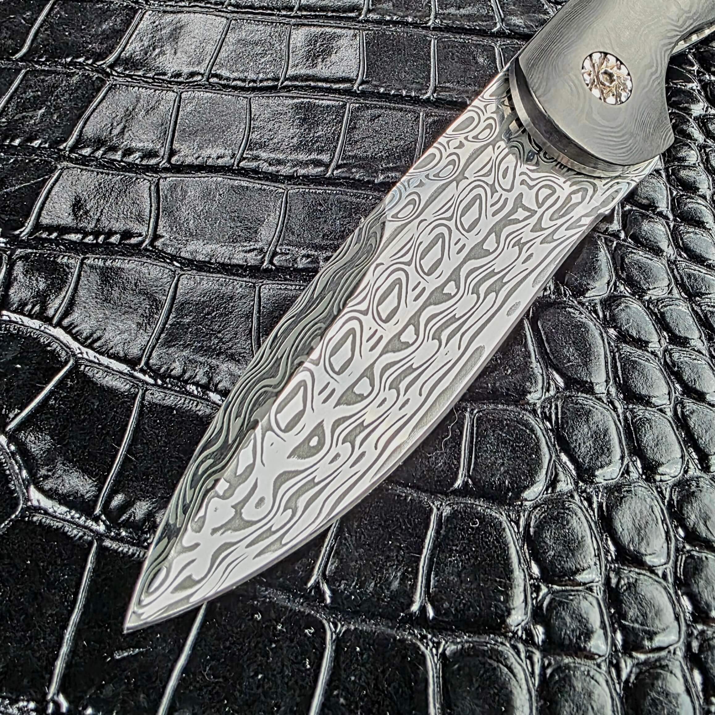 Full blade profile of the Glenn Are Hovin Koda modified drop point in Damasteel Svavner