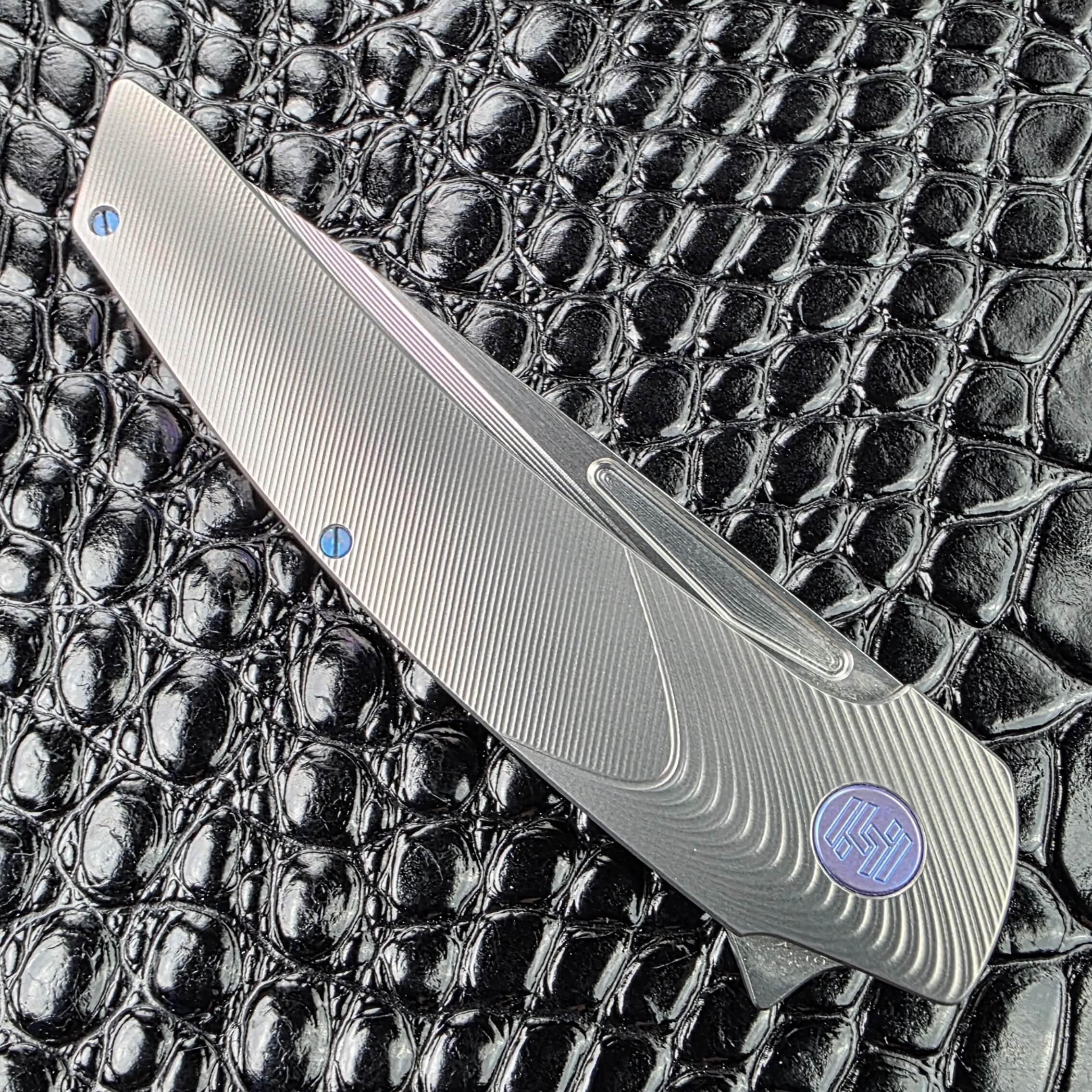 Hog House Model T Gen 2 closed on the show side, 4.56 inches of milled Gunmetal titanium