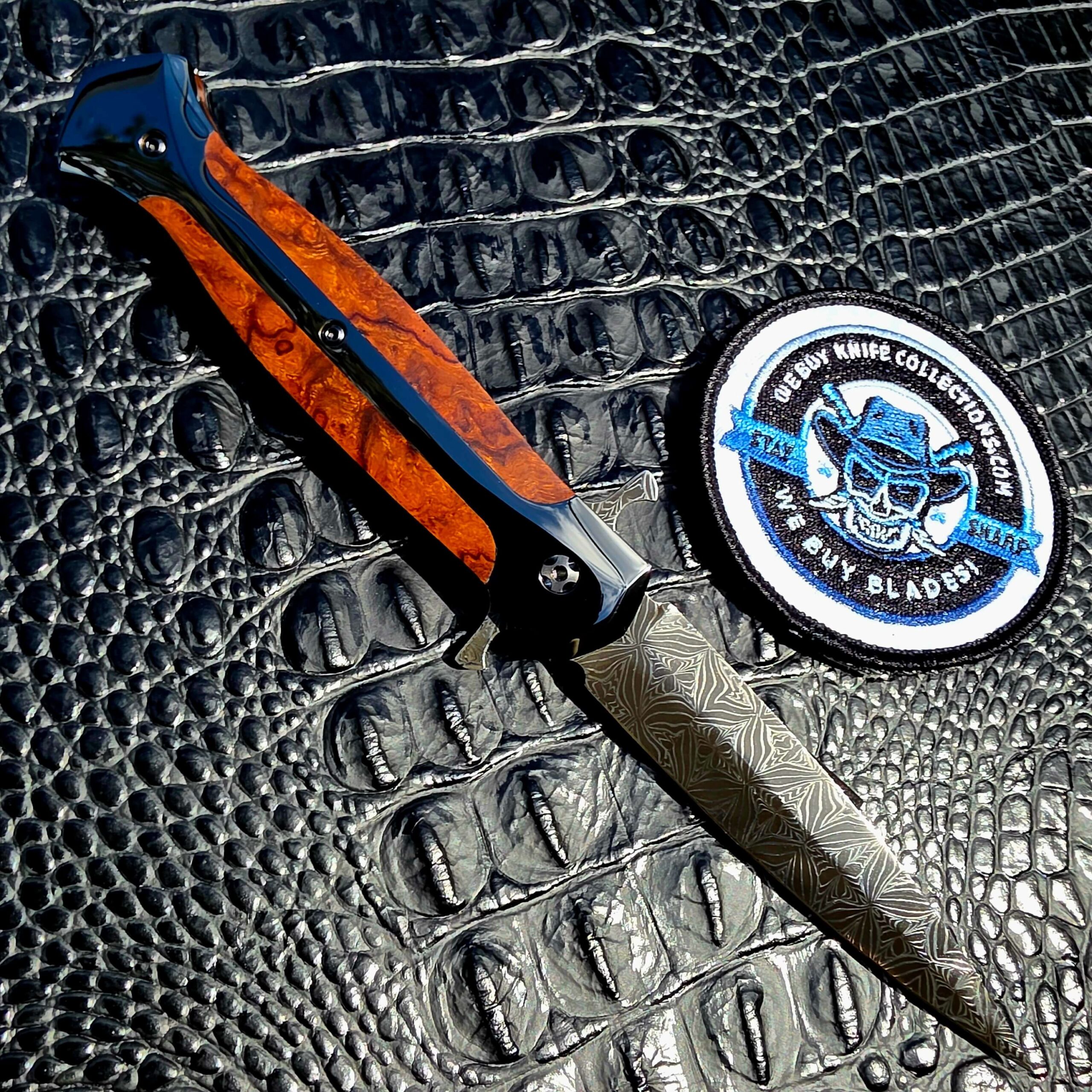 La Cantina Sally #453 open on the opposite face showing the polished DLC frame and ironwood inlay, with the We Buy Knife Collections patch in frame